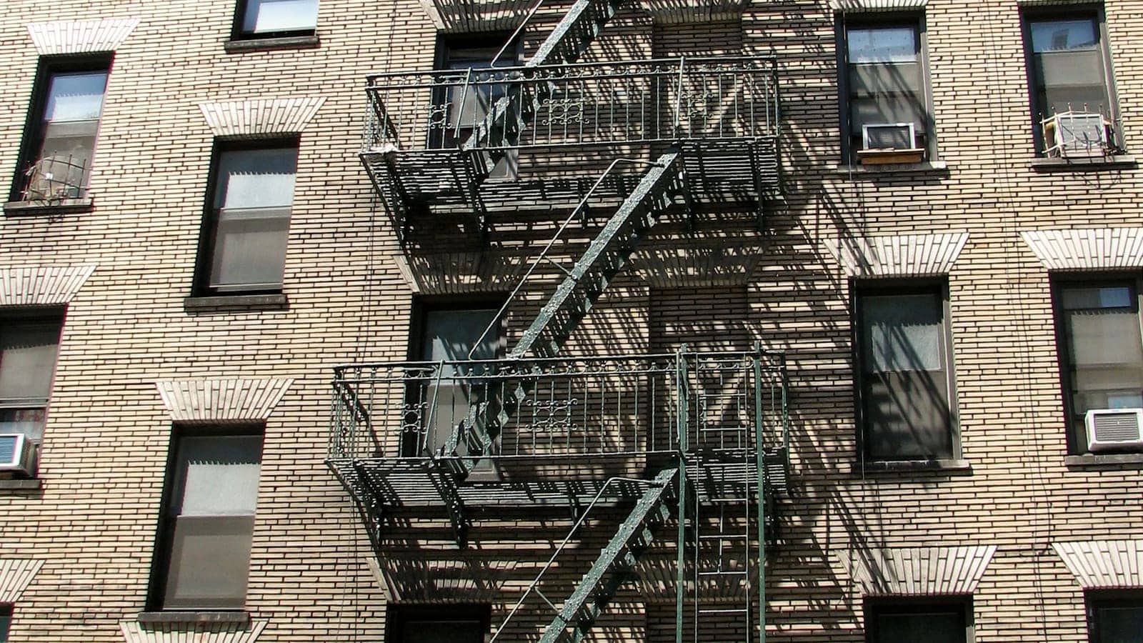 Exterior fire escapes on a New York City apartment building