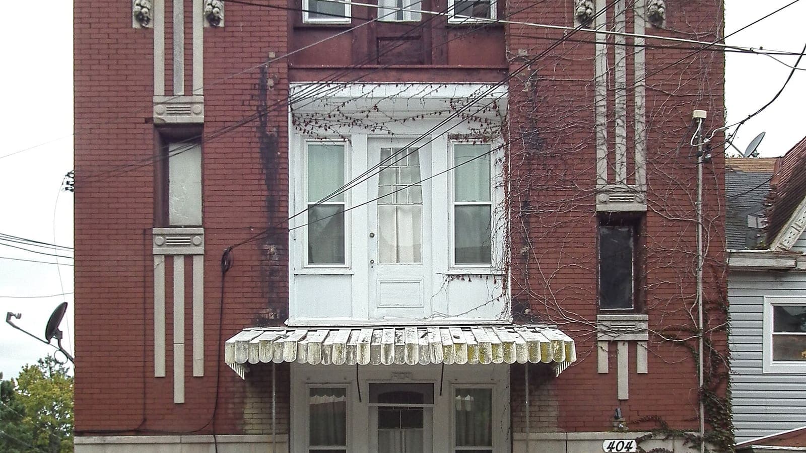 The entrance and facade of an Art Nouveau apartment building on Walter Street in Pittsburgh