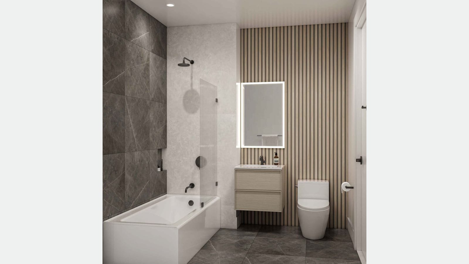 Rendering of a bathroom with a white bathtub and a half glass screen, dark gray stone-look wall tiles, a lit rectangular mirror over a small light wood vanity, a wall of thin vertical wood slats, a white toilet and gray floor tiles, shown on a plain light gray background