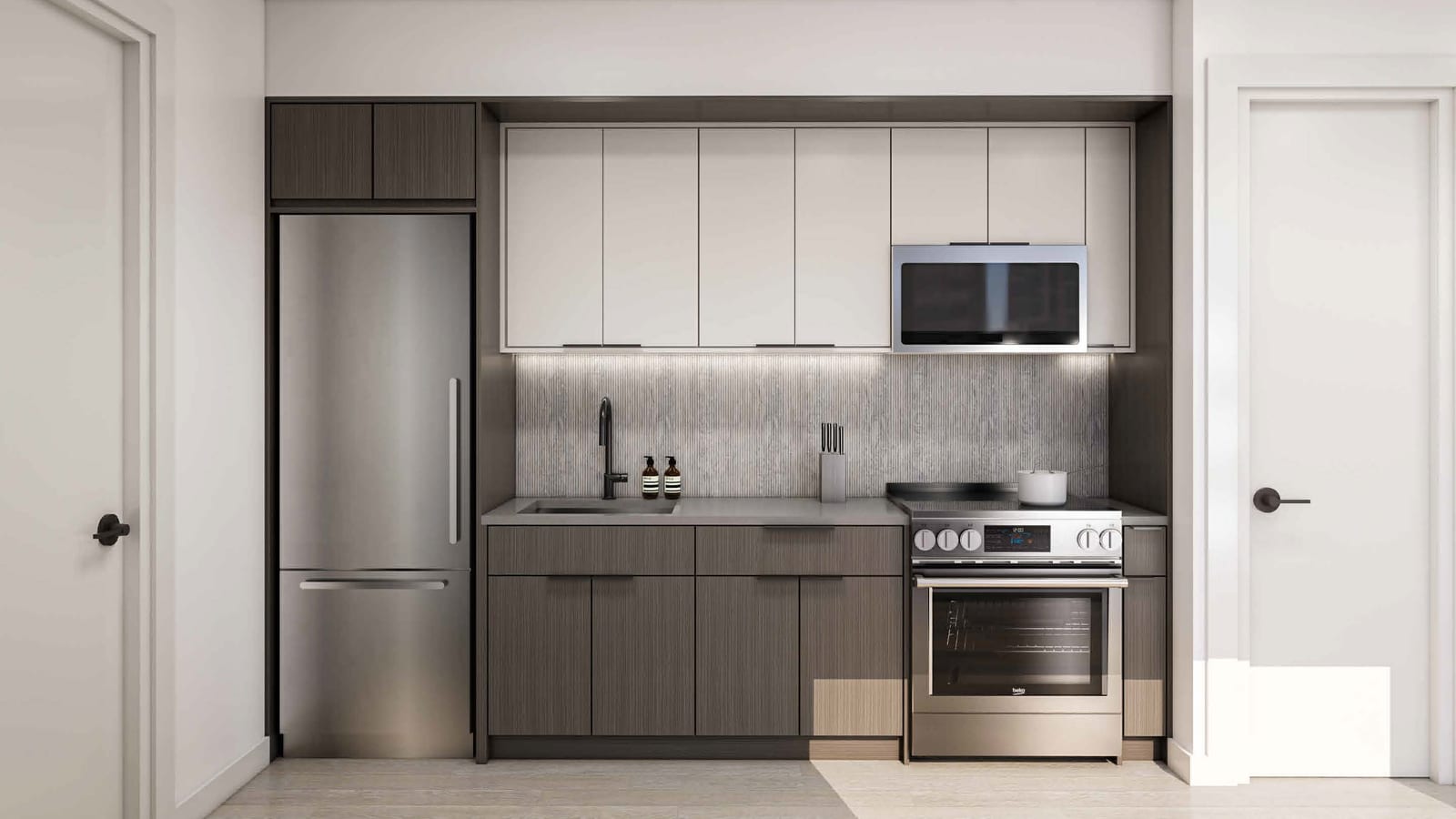 Rendering of a one-wall kitchen with a stainless steel refrigerator, white upper cabinets, dark wood lower cabinets, a black faucet, a microwave above a stainless steel range with a flat cooktop and front knobs, light wood floors, and white doors on each side