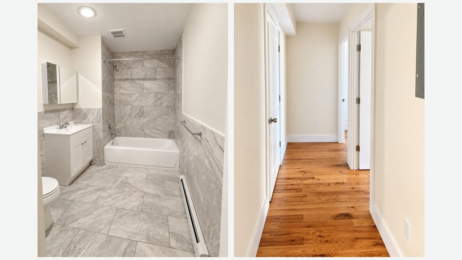 Two photographs side by side. Left: a bathroom with gray stone-look tile on the floor and lower walls, a white tub with a shower head and curtain rod, a white vanity sink, a mirrored cabinet, a toilet and a baseboard heater. Right: a narrow hallway with a wood floor, cream walls, white doors and door frames and an electrical panel on the right wall