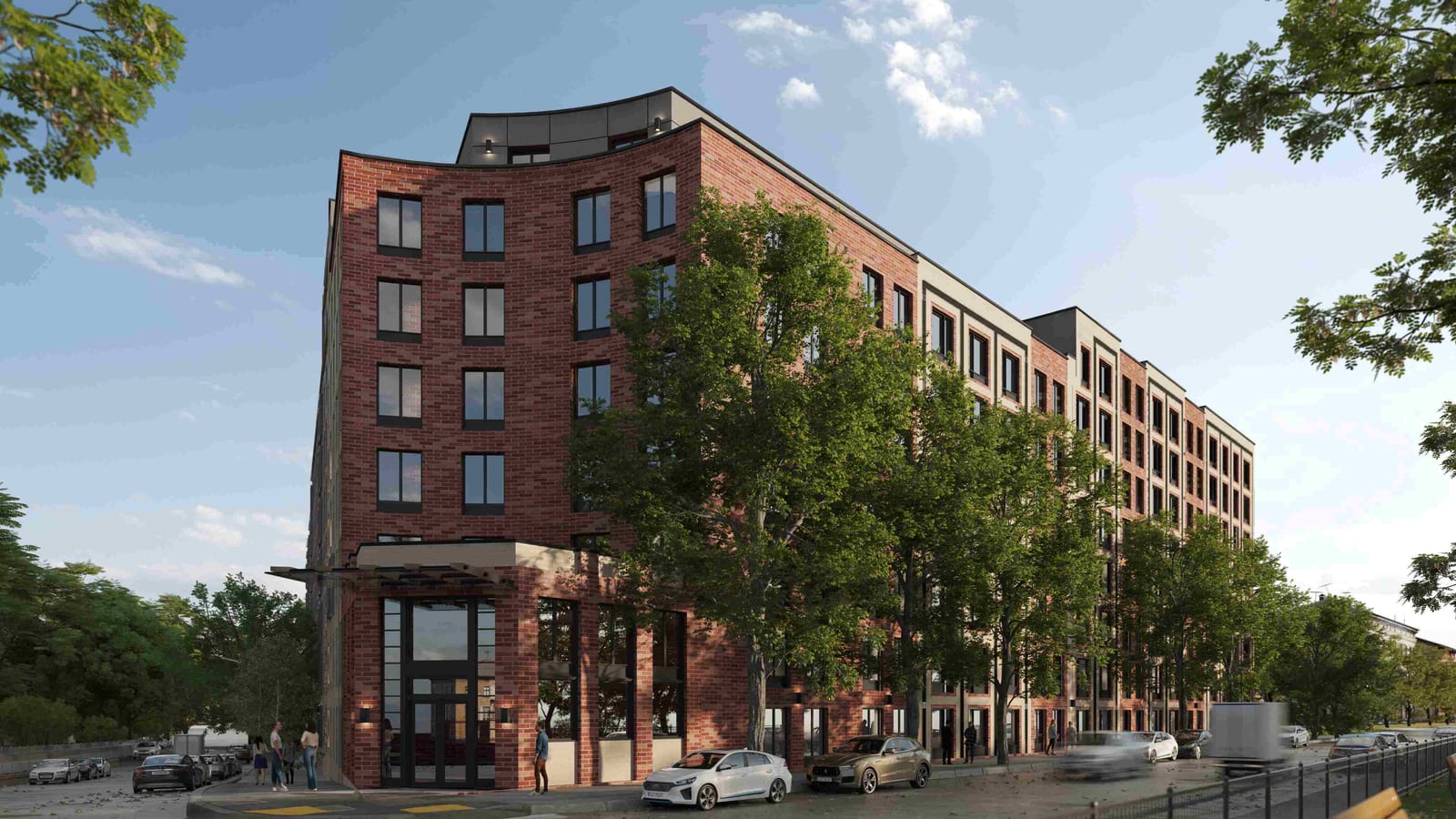 Rendering of the curved corner of a red brick apartment building with a tall glass entrance under a flat canopy, a top floor set back behind dark panels, large street trees along the side, parked cars at the curb and people walking near the door
