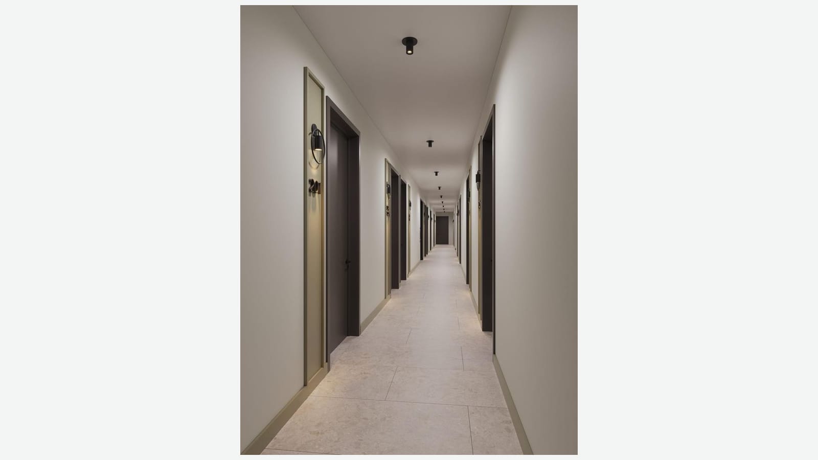 Rendering of a long, narrow apartment hallway with pale walls, dark brown doors in tall gold-edged frames, round black wall lights, door numbers in large metal digits, small black ceiling lights and a light stone-look tile floor, shown in the middle of a plain light background