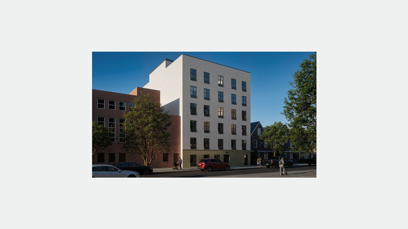 Rendering of a six-story building with a smooth white facade and rows of tall dark-framed windows above a tan brick ground floor with doors, beside a red brick building on the left and peaked-roof houses on the right, with trees, parked cars, a red SUV on the street and a few small figures on the sidewalk under a clear blue sky, shown on a plain light background