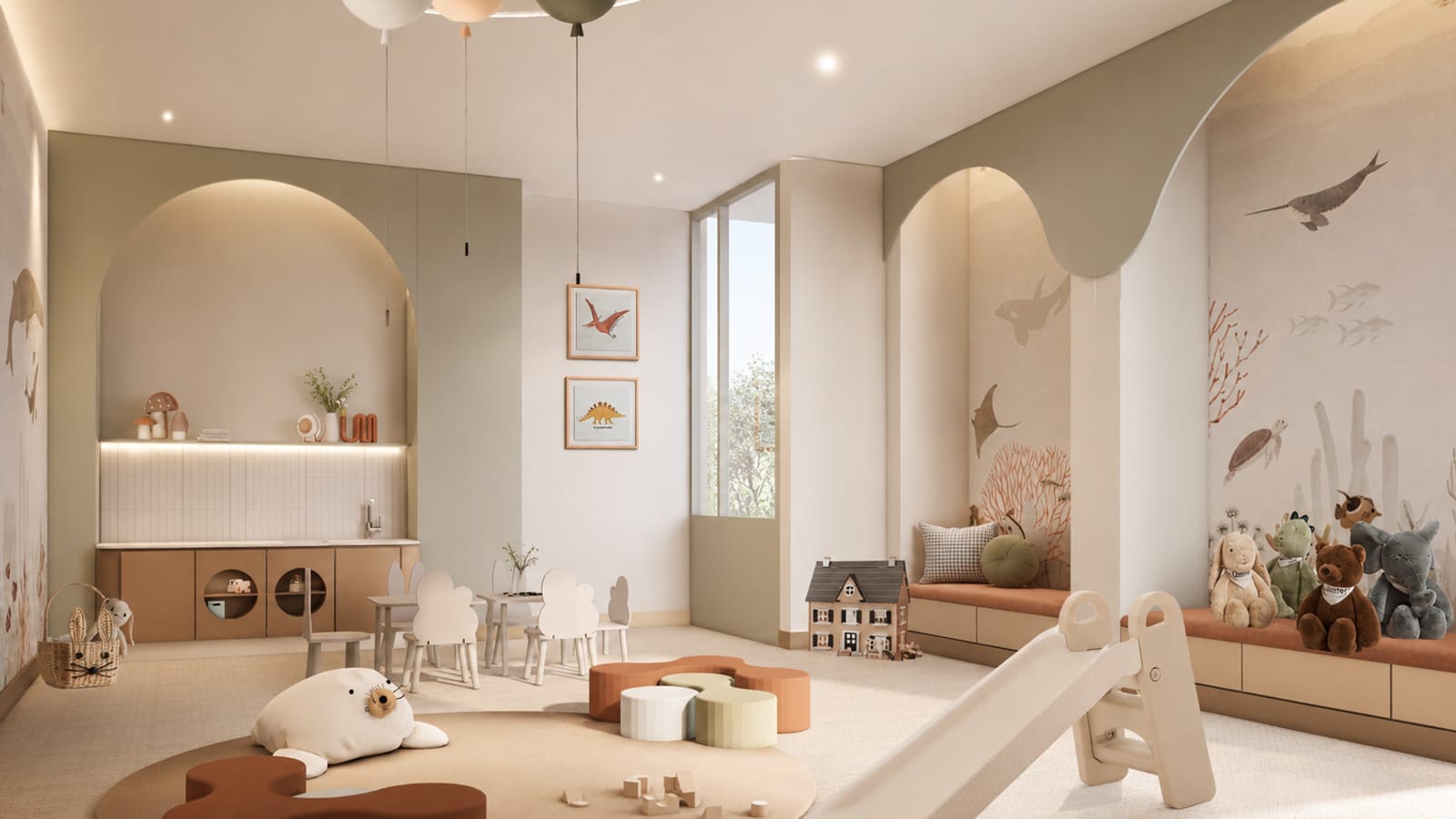 Rendering of a children's playroom with arched alcoves, an ocean-animal mural, small white tables and chairs, a dollhouse, a toy slide, floor cushions, stuffed animals on a bench and balloon-shaped ceiling lights