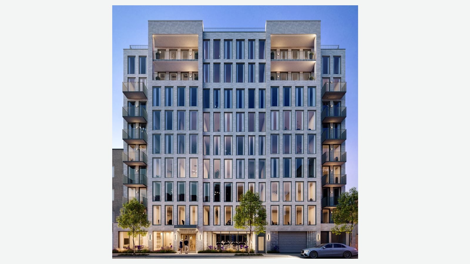 Rendering of a nine-story apartment building at dusk with a light gray brick front, tall narrow windows, stacked balconies on both sides, recessed terraces near the top, street trees, a garage door at right and a silver car at the curb