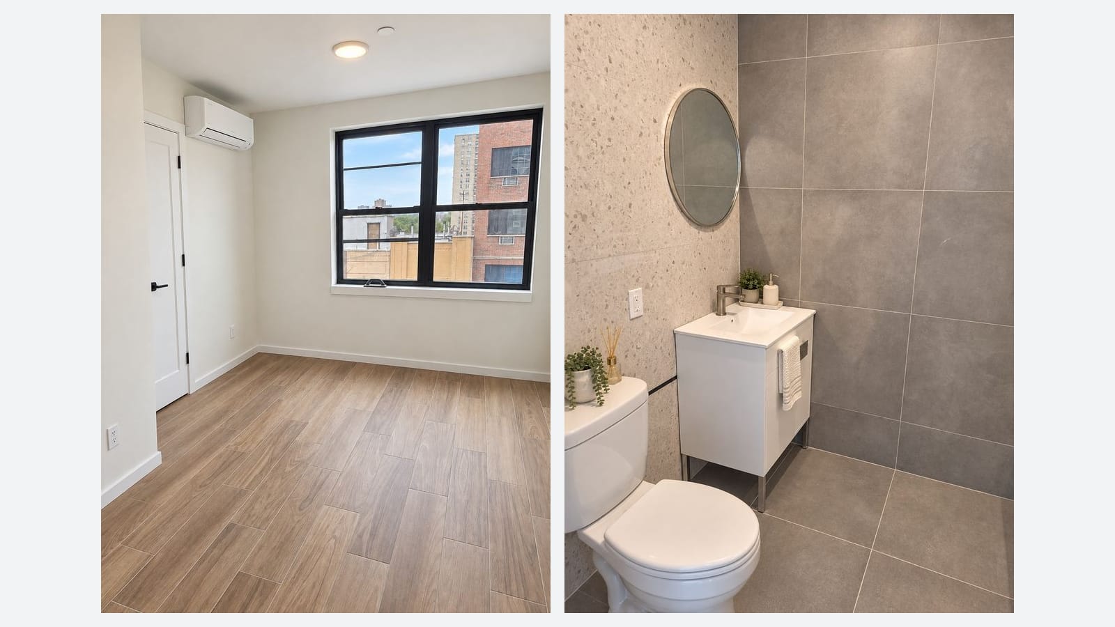 Two photos side by side on a light grey background: at left an empty room with wood-look plank flooring, white walls, a white door, a wall-mounted split air conditioner and a black-framed double window looking out at brick buildings and a tall tower; at right a bathroom with large grey wall and floor tiles, a speckled tile wall, a round mirror, a small white vanity with a towel and a white toilet with a plant on the tank