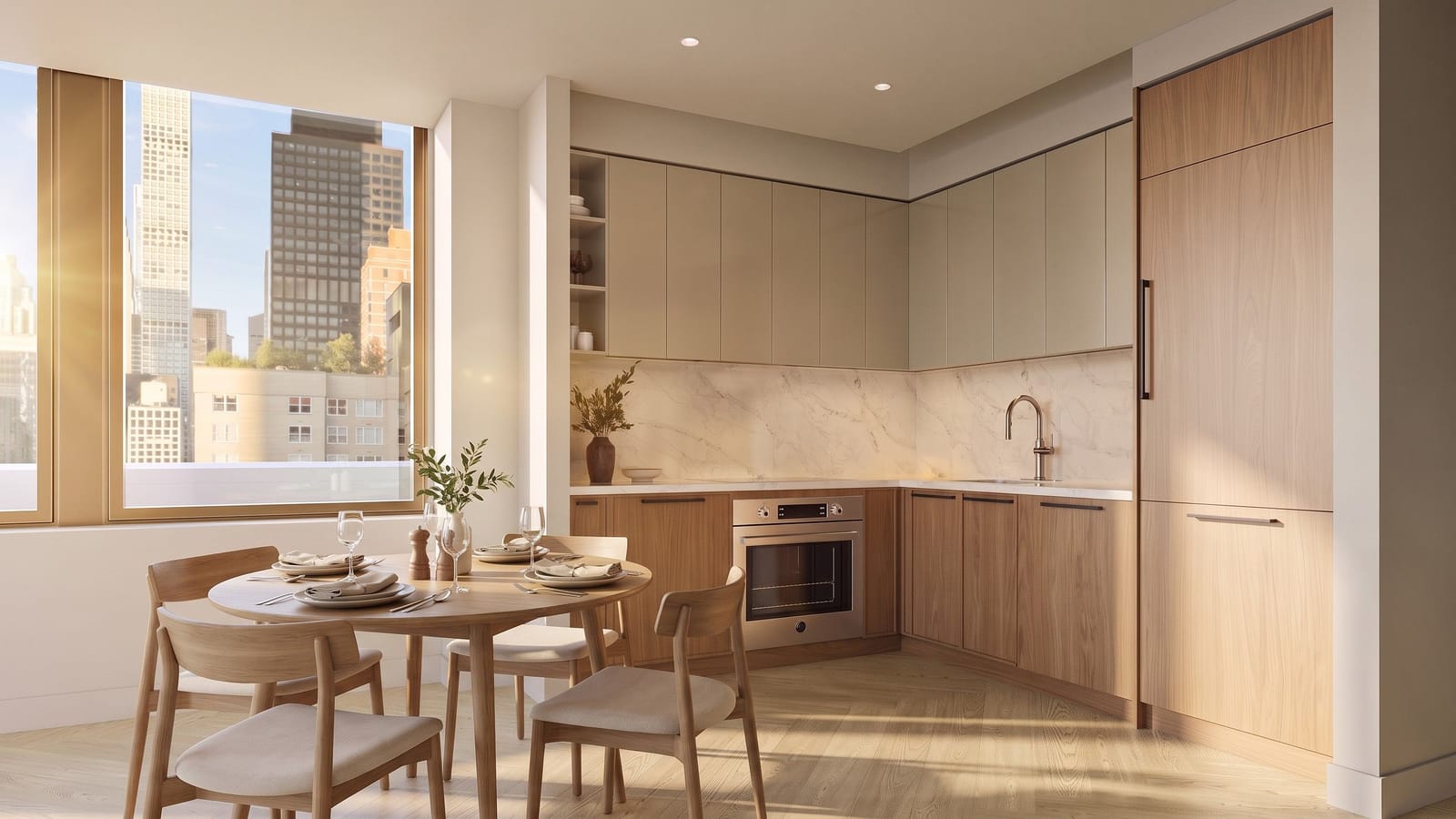 Rendering of a kitchen with pale cabinets and a wall oven, a round dining table with four chairs and a window onto Midtown towers
