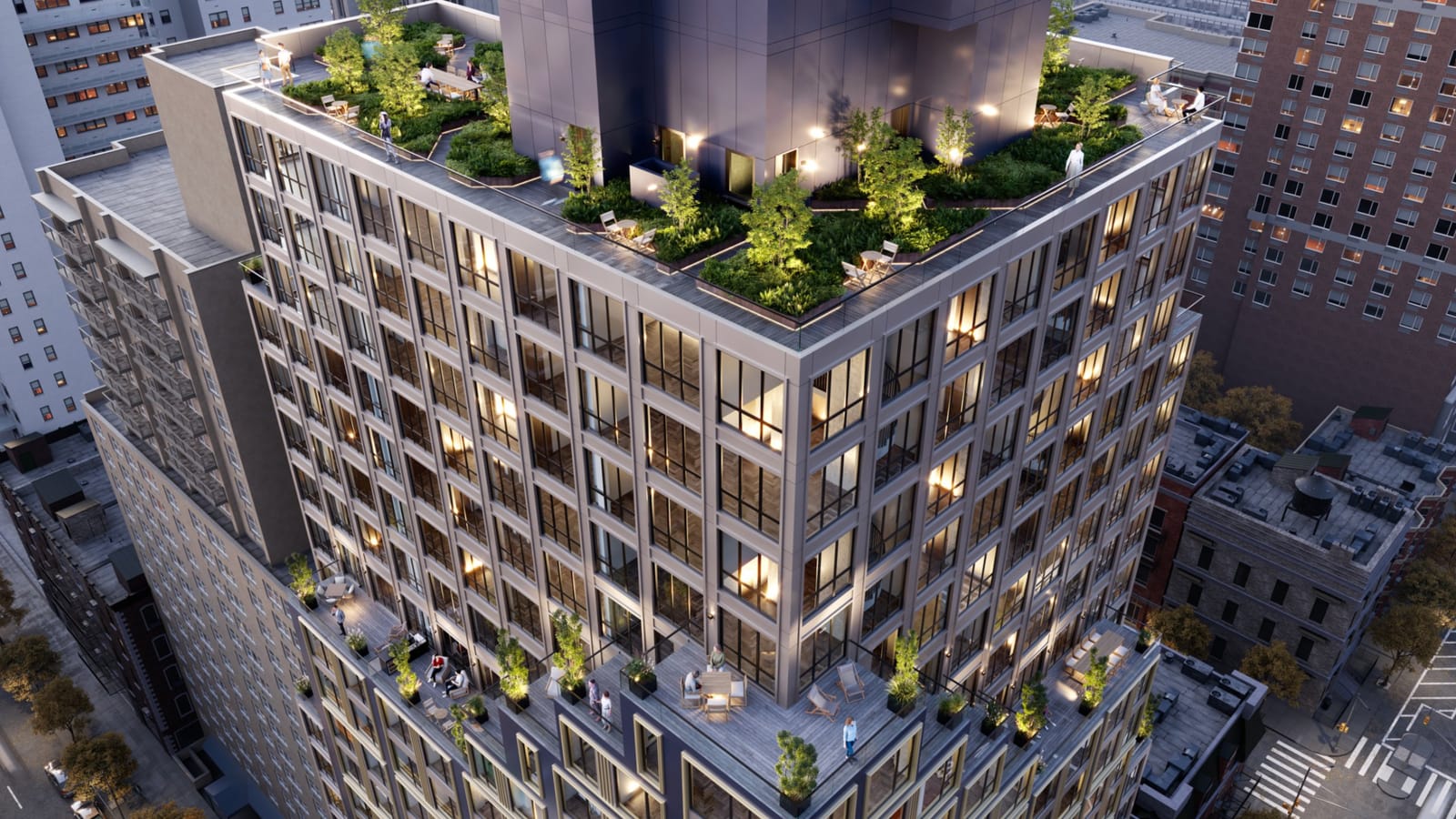 Rendering from above of the roof at dusk: a planted terrace with small trees, tables and chairs and lit paths around a dark metal box, glass railings at the edge, and lower setback terraces with lounge chairs and planters