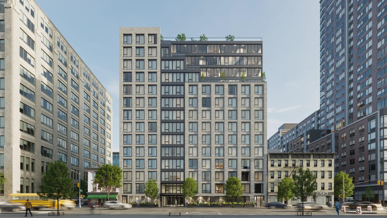 Rendering of a 14-story apartment building of light and dark gray brick, set between low older buildings on a wide avenue, with a glass upper section and roof terrace plants, a two-story glass entrance, planters along the sidewalk, street trees, a yellow school bus and blurred traffic