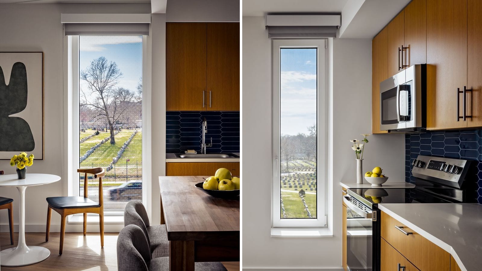 Two photographs side by side: at left a tall window beside a kitchen sink and two dining tables, looking across a road at rows of gravestones and bare trees; at right a narrow window beside a kitchen with wood-tone cabinets, a microwave, a smooth-top electric range and a dark blue tile backsplash, looking down on a cemetery