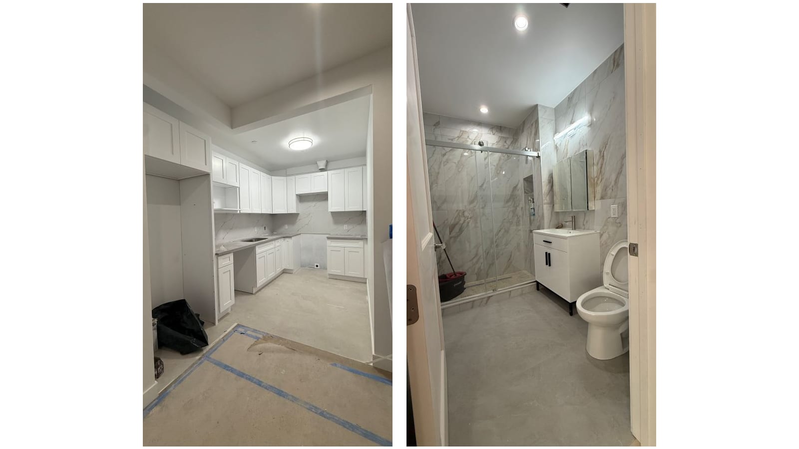 Two photographs side by side on a white background: at left an unfinished kitchen with white shaker cabinets, a grey stone counter with a sink, a marble-look backsplash and a round ceiling light, with no appliances in place, protective paper and blue tape on the floor and a black bag in a corner; at right a bathroom with marble-look tile walls, a glass sliding shower door, a white vanity with a mirrored cabinet above it and a toilet, with a mop bucket standing in the shower