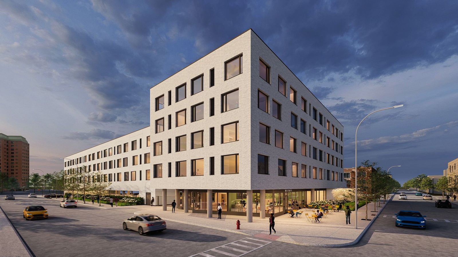 Rendering of a five-story white brick apartment building at a street corner at dusk, with a glass ground floor, outdoor tables and a lower wing running along the side street