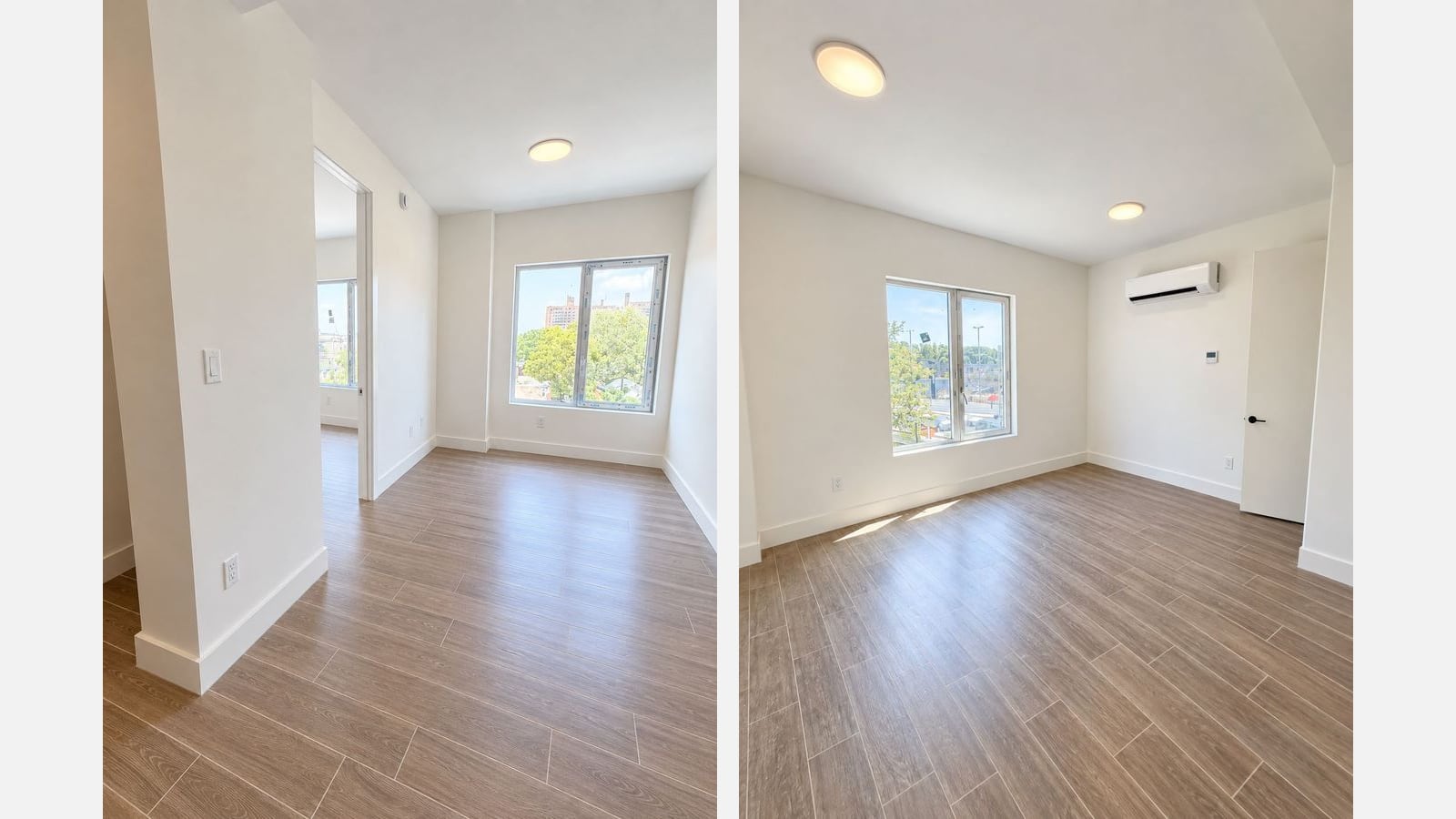 Two photographs of empty rooms side by side: at left a white room with wood-look plank flooring, a ceiling light, a double window looking out on trees and tall brick apartment towers, and an open doorway to a second room with another window; at right a white room with the same flooring, two ceiling lights, a double window looking out on a wide street, a wall-mounted white unit with a small thermostat below it and an open door