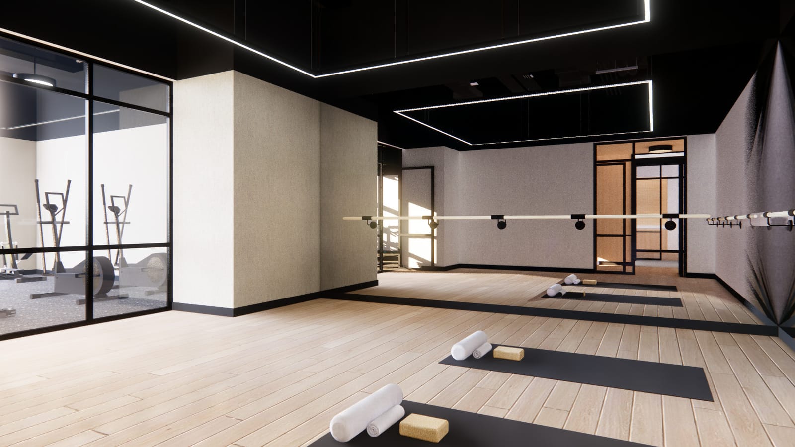 Rendering of an exercise studio with a light wood floor, three black yoga mats with rolled towels and blocks, a wall-length ballet barre and mirror, and a glass wall looking into a room with elliptical machines