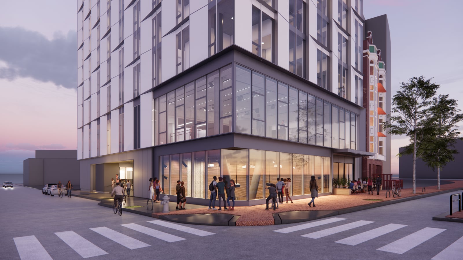 Rendering at dusk of a street corner with a glass-walled two-story base under a white tower, people gathered on the sidewalk and a crosswalk in the foreground
