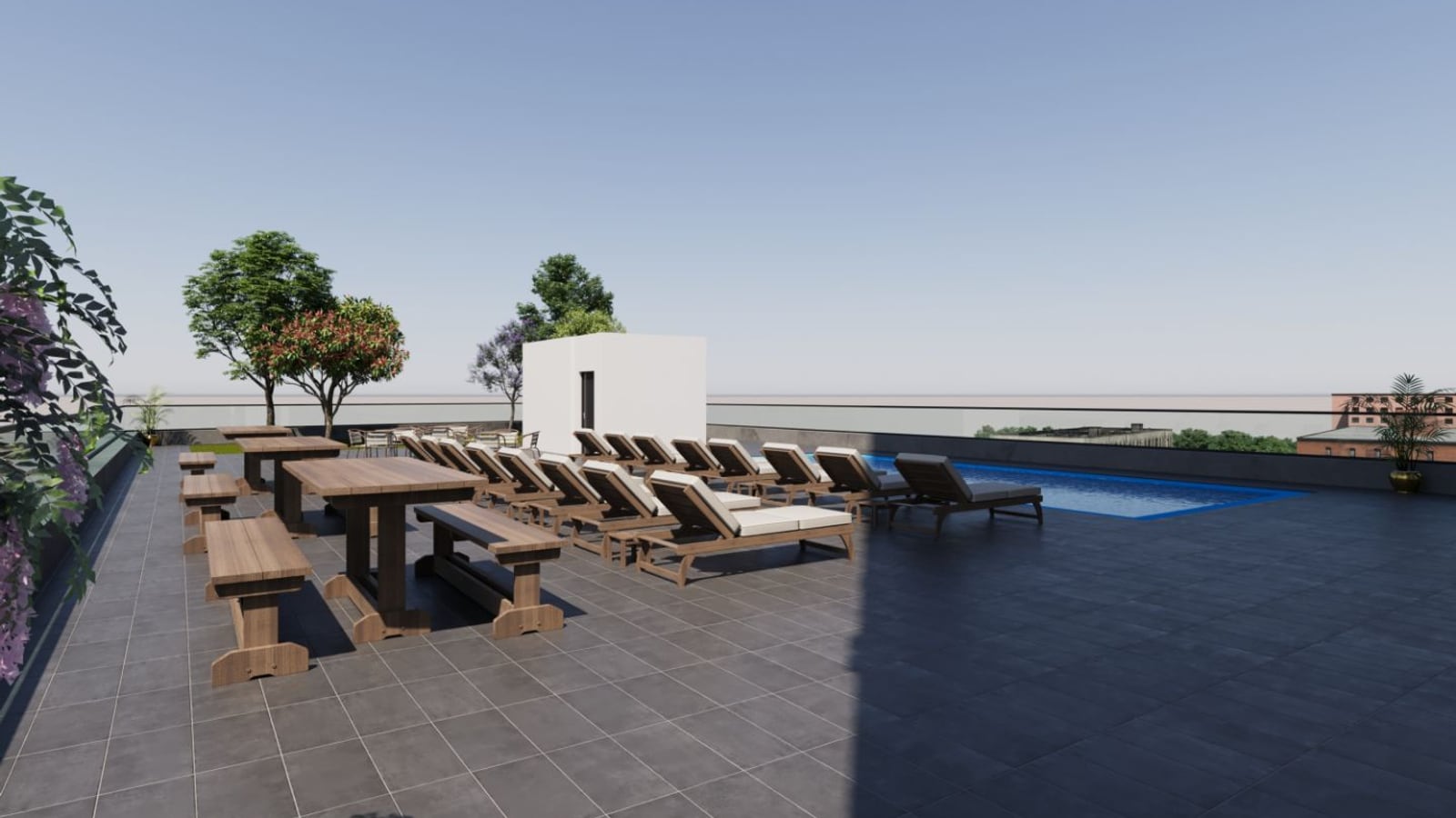 Rendering of a rooftop terrace paved in dark tile with wooden picnic tables, a row of wooden lounge chairs beside a small rectangular pool, a white bulkhead, planters with small trees and a low glass parapet under a clear sky