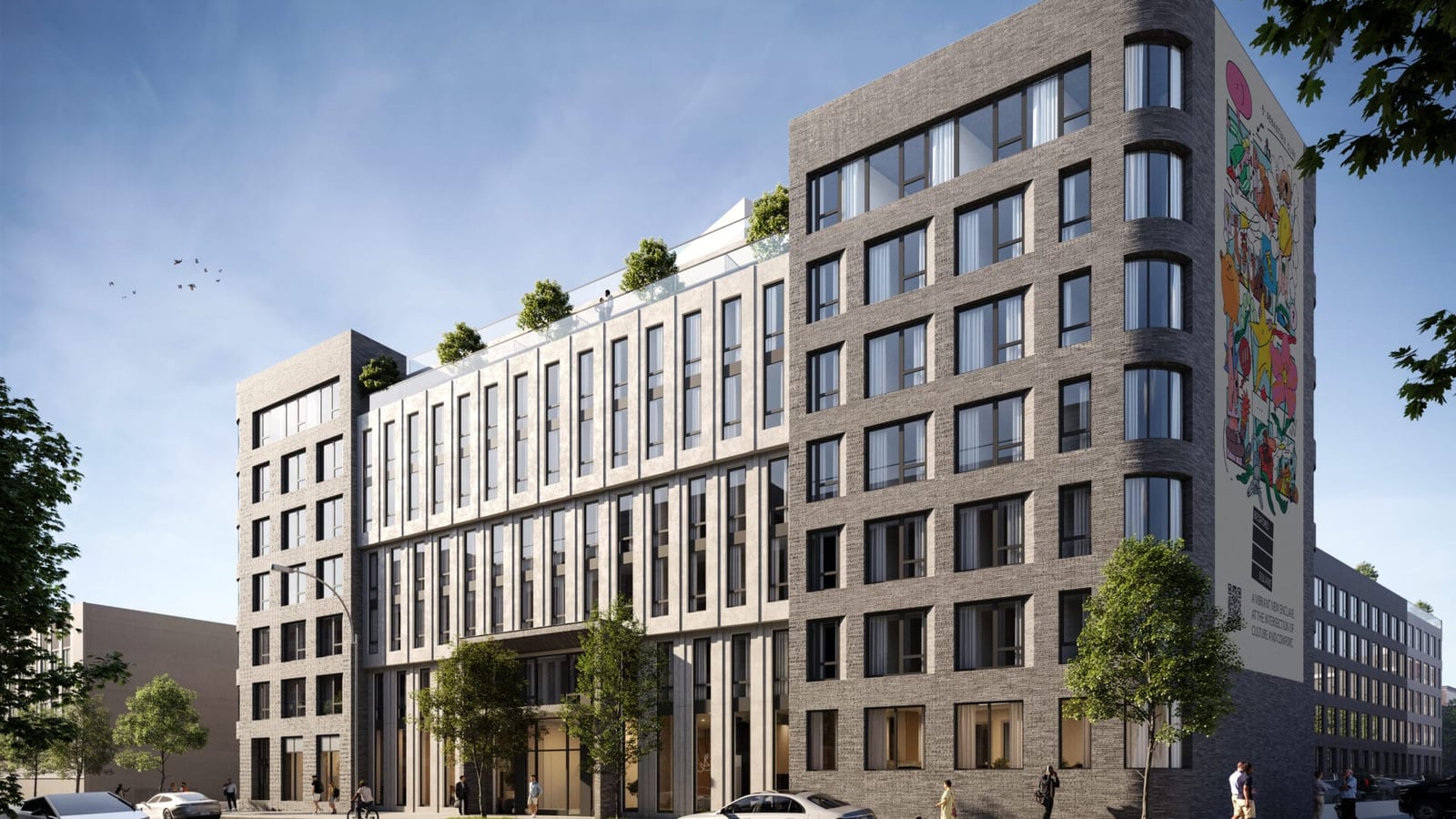 Rendering of a seven-story apartment building with grey brick end sections and a pale center of tall narrow windows, planted roof setbacks, a colorful mural covering the full height of one side wall, street trees and people on the sidewalk