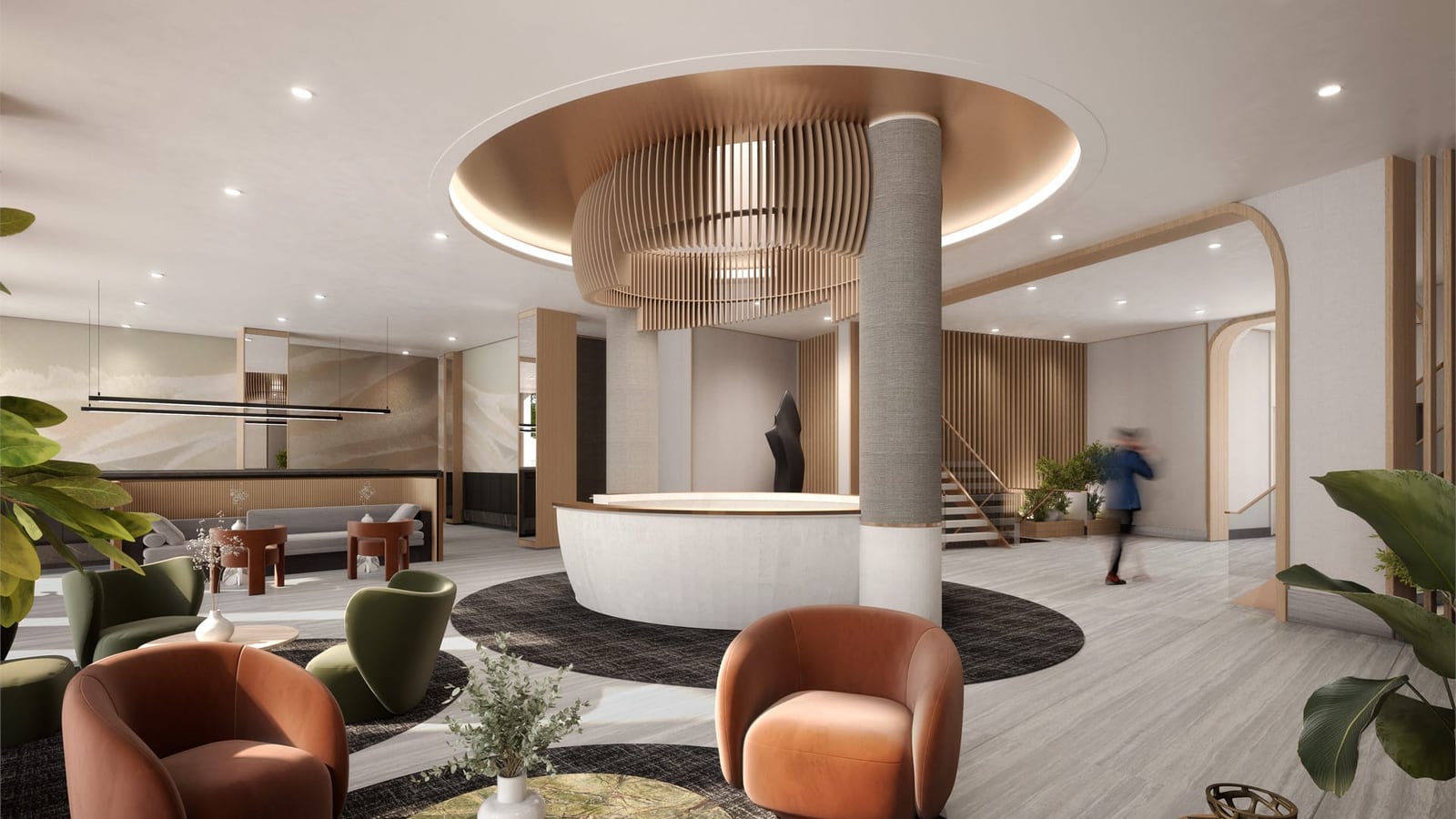 Rendering of a lobby with a round white reception desk beneath a circular copper-colored ceiling recess and a slatted wood light fixture, a grey column, orange and green armchairs on dark round rugs, a staircase and a blurred figure walking past