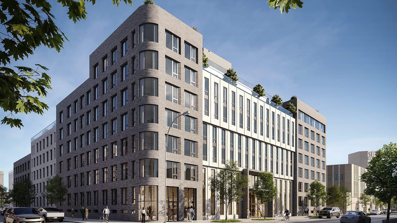 Rendering of a seven-story apartment building on a street corner, with a rounded corner of grey brick and curved windows, a pale middle section of tall narrow windows above a recessed entrance, planted terraces on the upper setbacks, street trees, cars and people on the sidewalk, and at the far right a lower beige building with a tower carrying partly hidden lettering