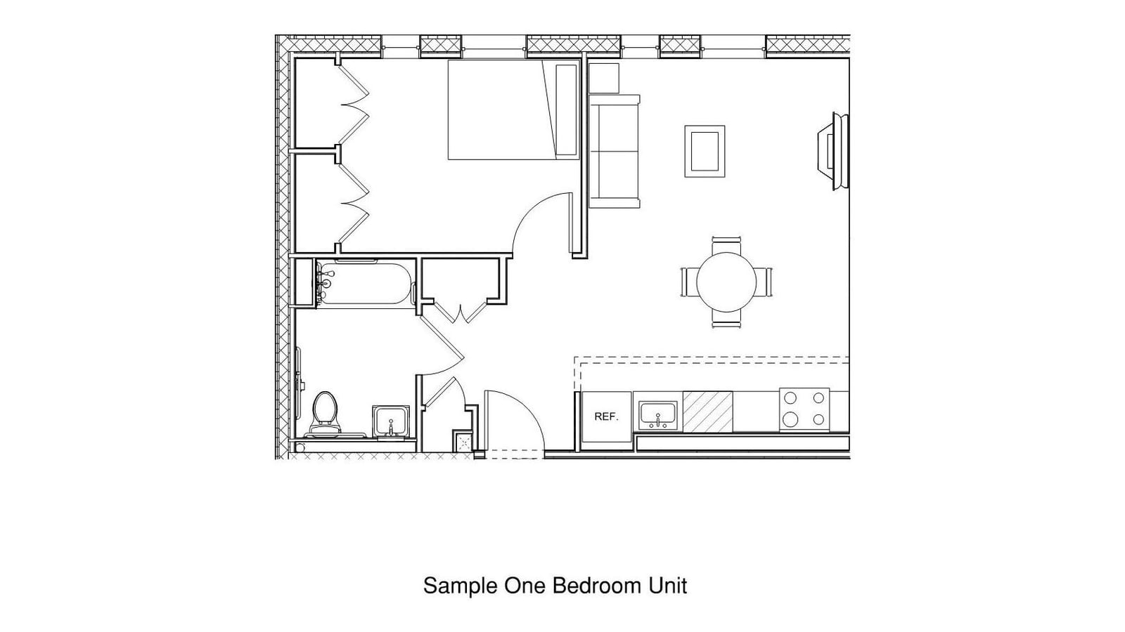 Floor plan line drawing of a one-bedroom apartment: a bedroom with a bed and two closets, a living and dining room with a sofa and round table, a kitchen along one wall with refrigerator, sink and four-burner range, and a bathroom with a tub; labeled Sample One Bedroom Unit