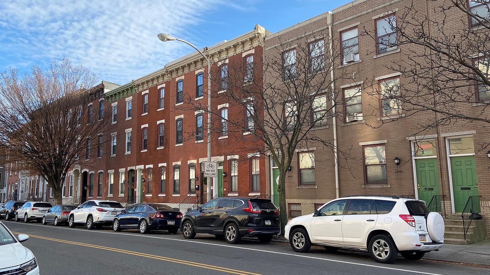 Brick rowhouses lining a city street