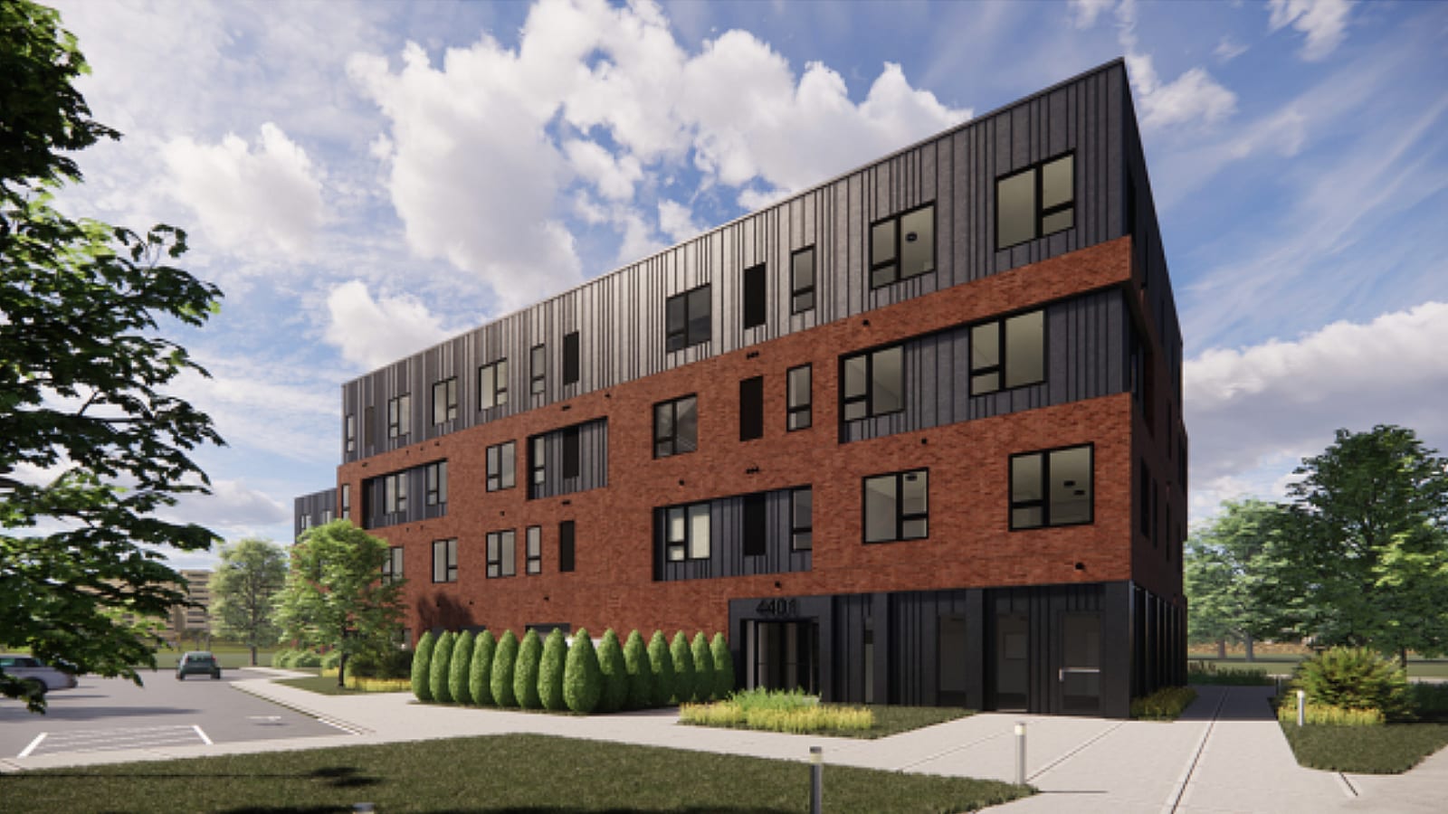 Rendering of the corner of a four-story brick and dark metal apartment building with the number 4401 over a glass ground-floor entrance, a row of clipped evergreen shrubs and a parking lot to the left
