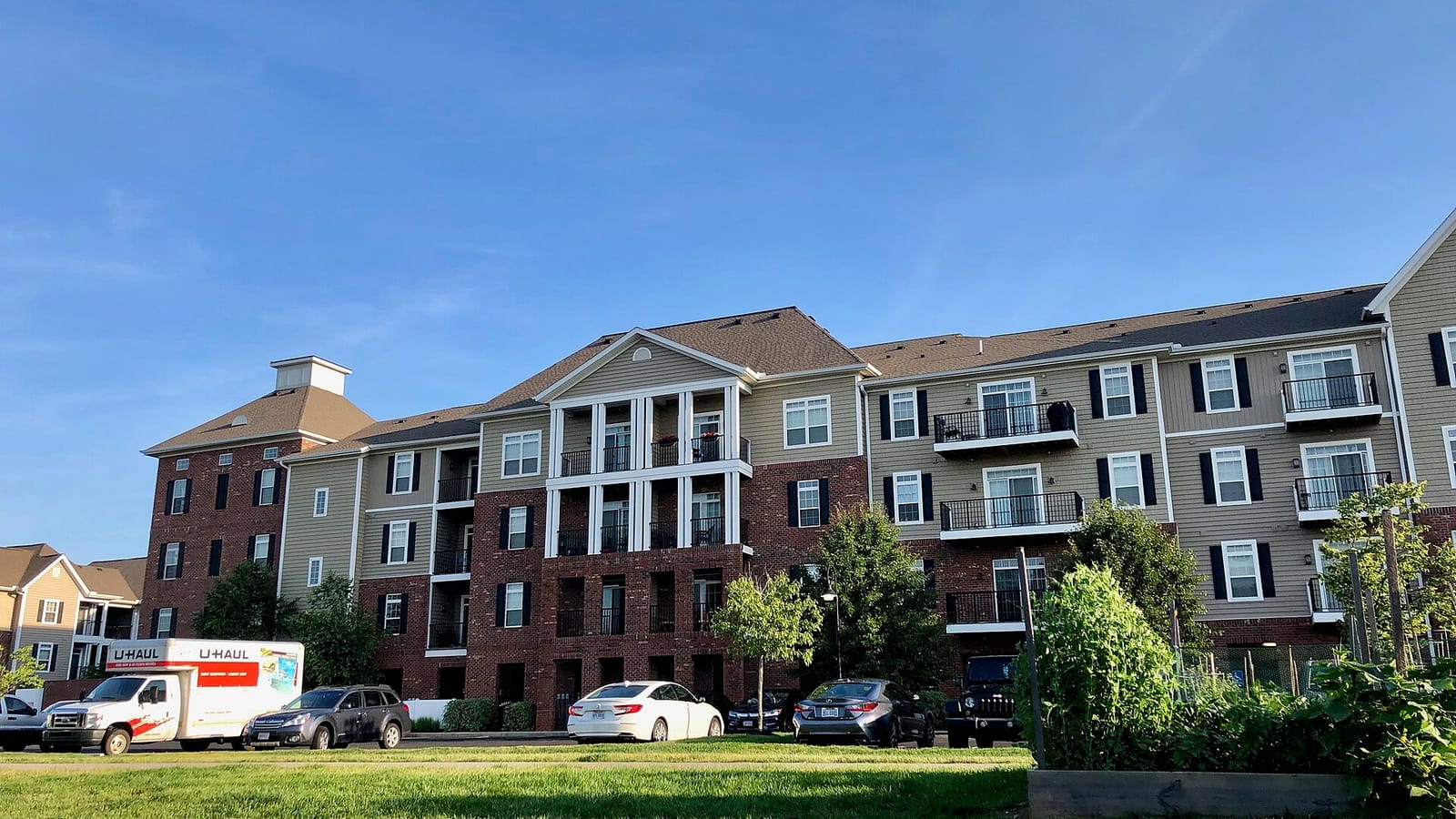 Apartment buildings with brick and pale facade panels