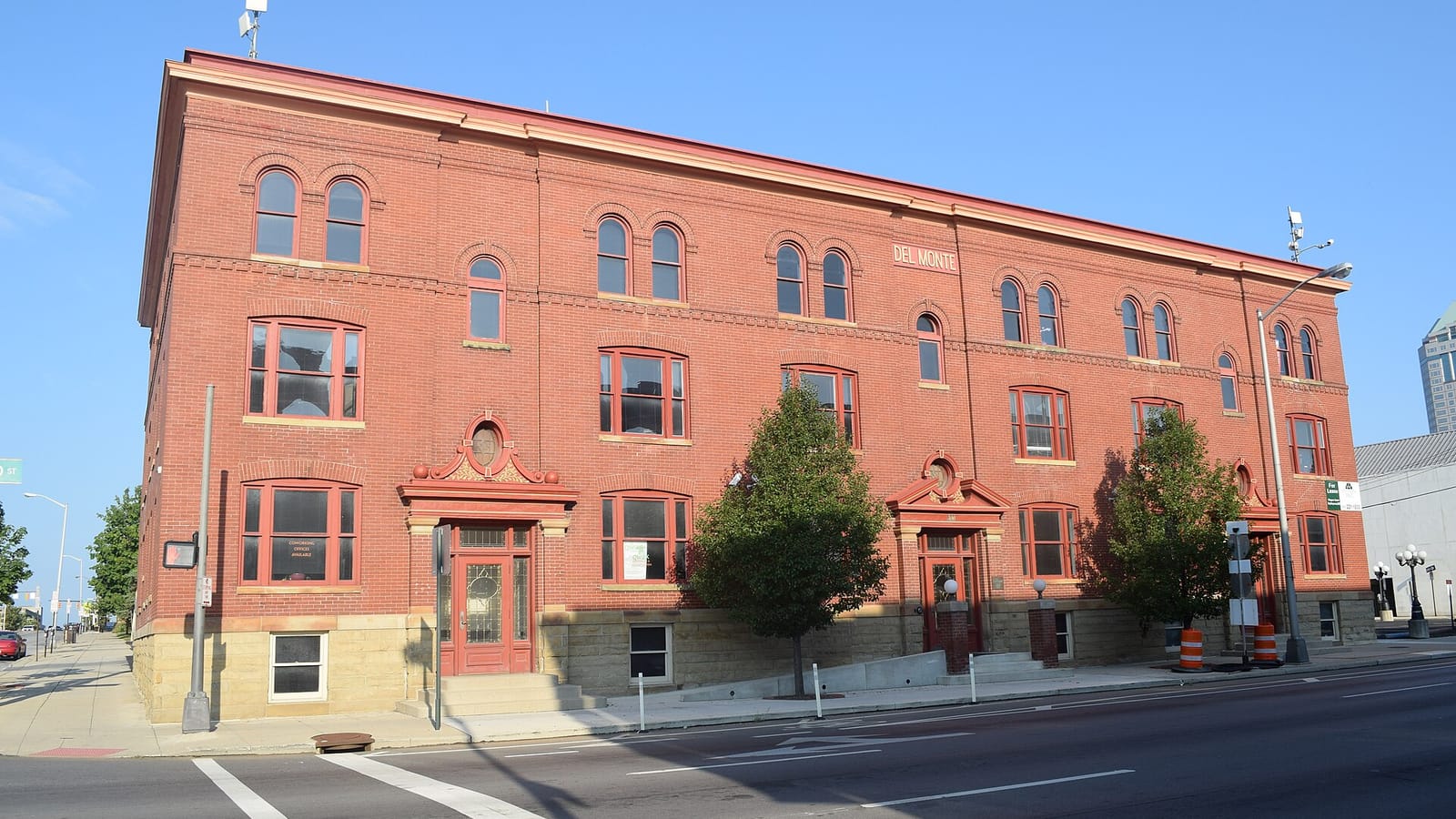 Red brick apartment building with arched windows