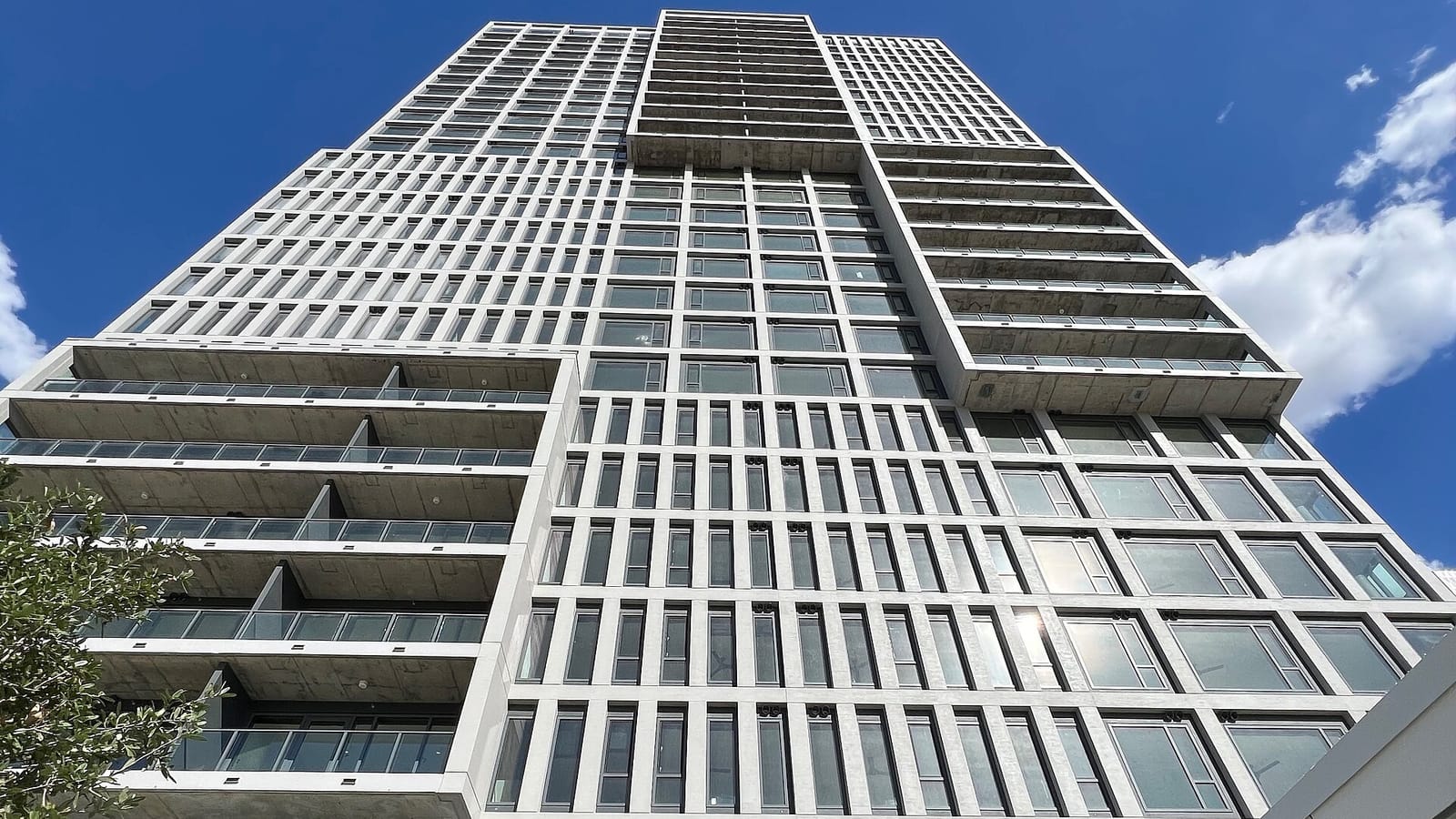 Modern apartment tower viewed from below