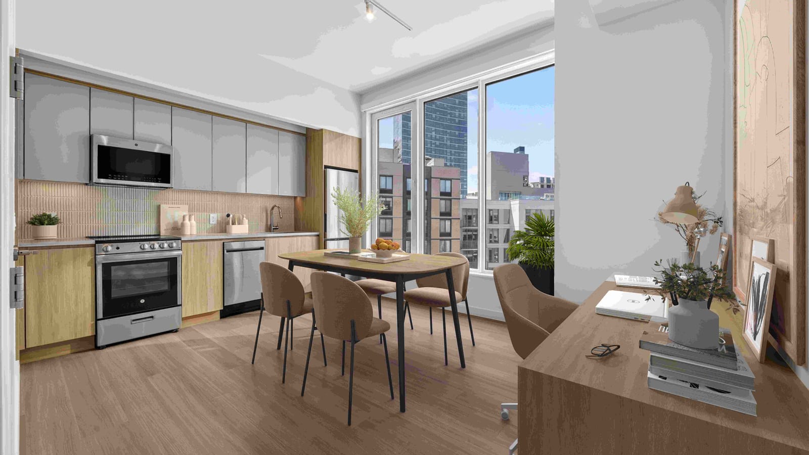 Kitchen with grey upper cabinets, wood lower cabinets and stainless steel appliances beside a dining table and a window onto nearby towers