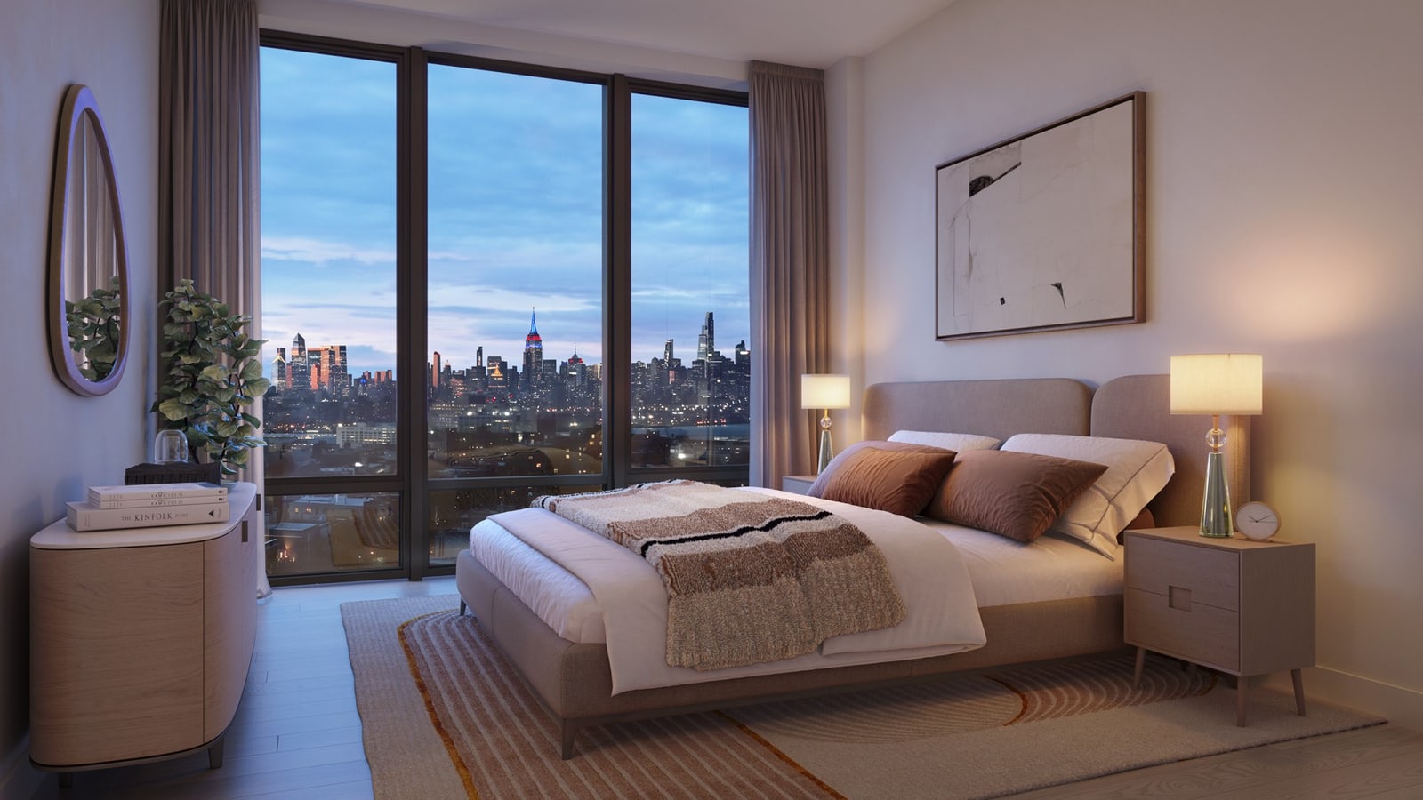 Rendering of a furnished bedroom at dusk with a bed, two nightstands with lamps, a rounded dresser, an oval mirror and curtains drawn back from a floor-to-ceiling window that looks toward a lit skyline