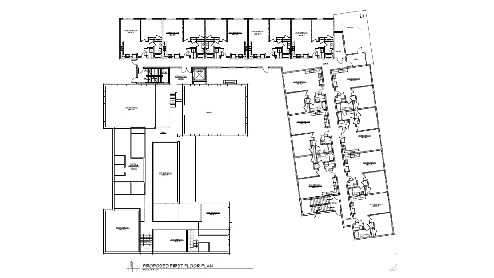 Line drawing of a first floor plan with a row of apartments along the top, a wing of apartments at the right and larger rooms in an older L-shaped building at the left