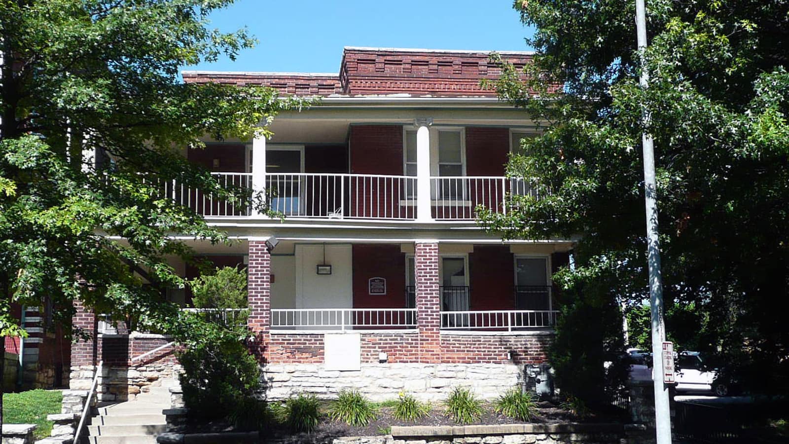 Brick apartment building with broad stacked porches