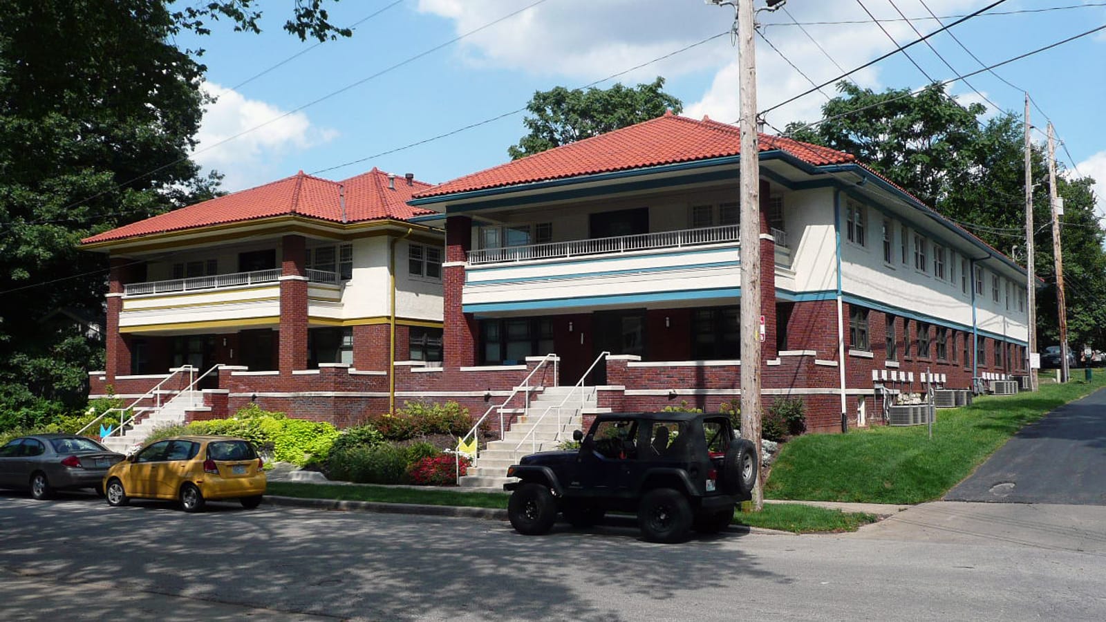 Low brick apartments along a street corner