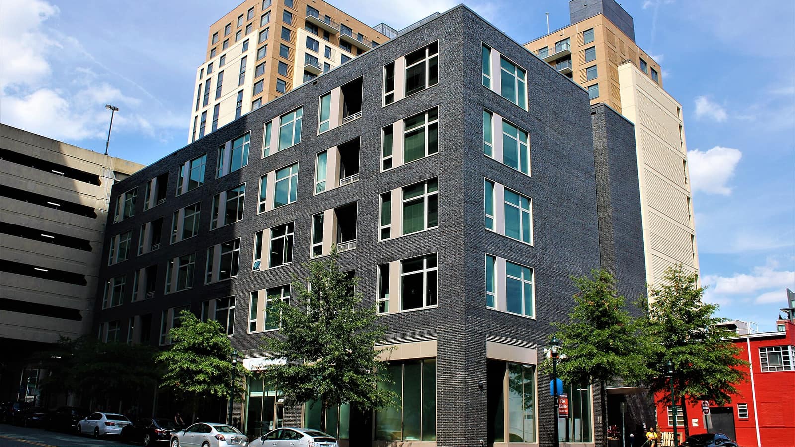Modern apartment building with dark facade panels
