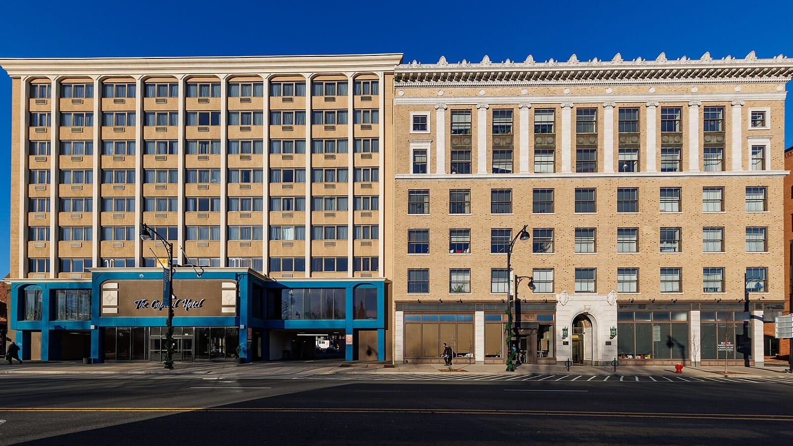 Hotel and apartment facades facing a wide city street