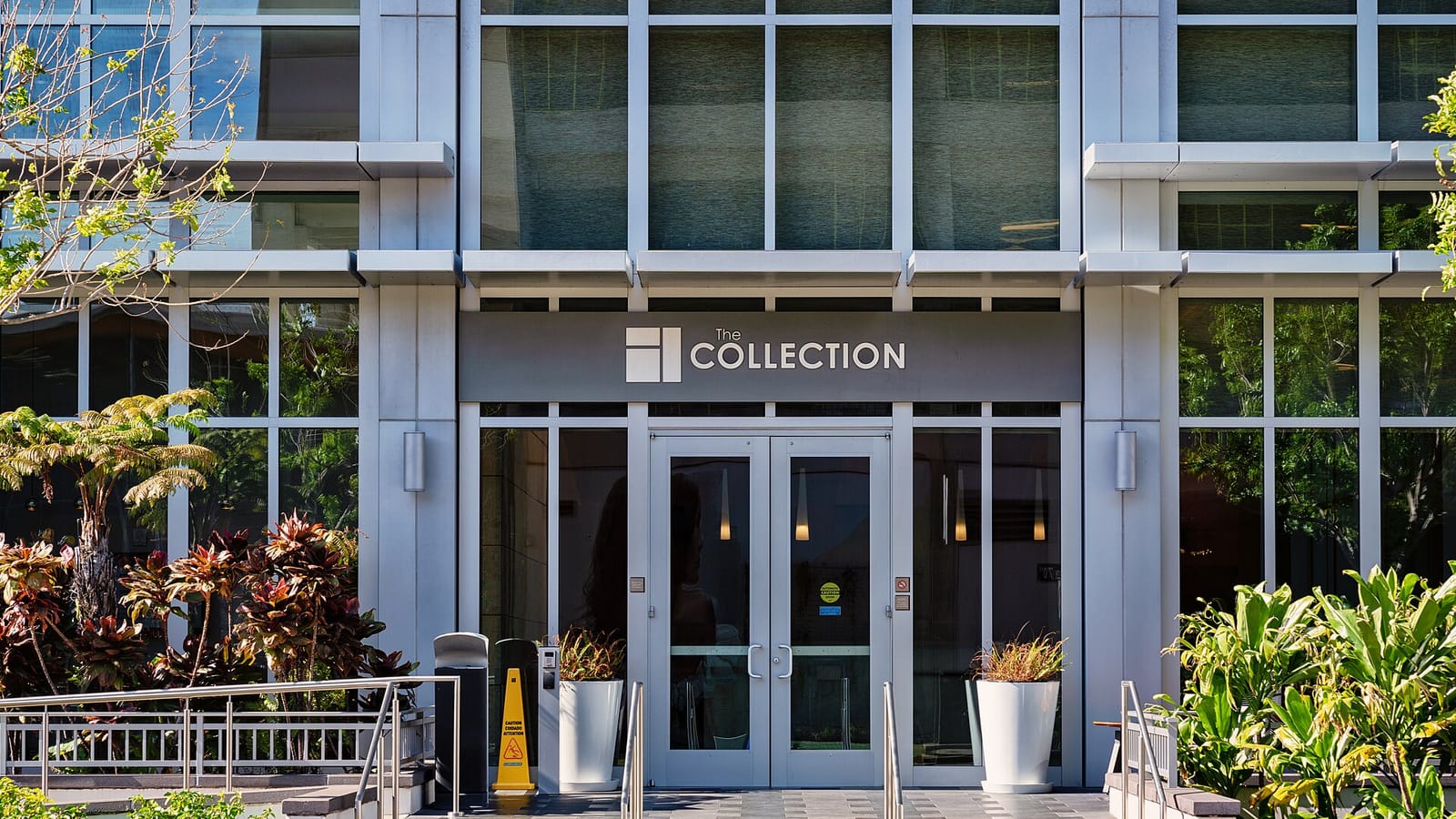 Modern condominium entrance with glass doors