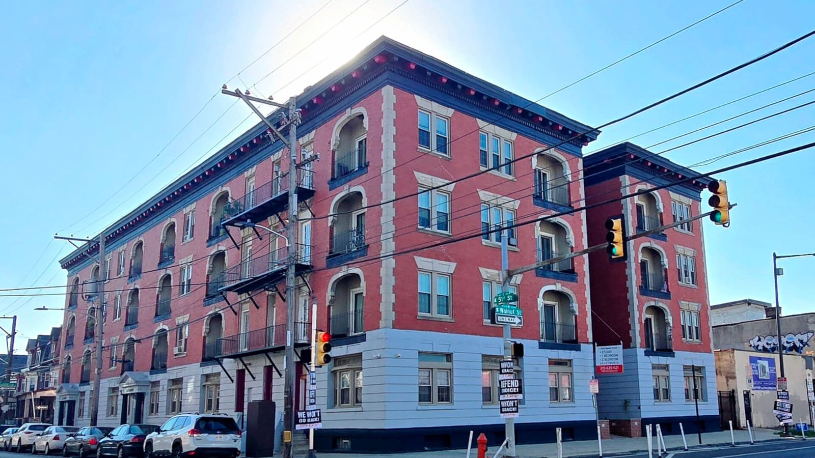The red facade of La Blanche Apartments in Philadelphia