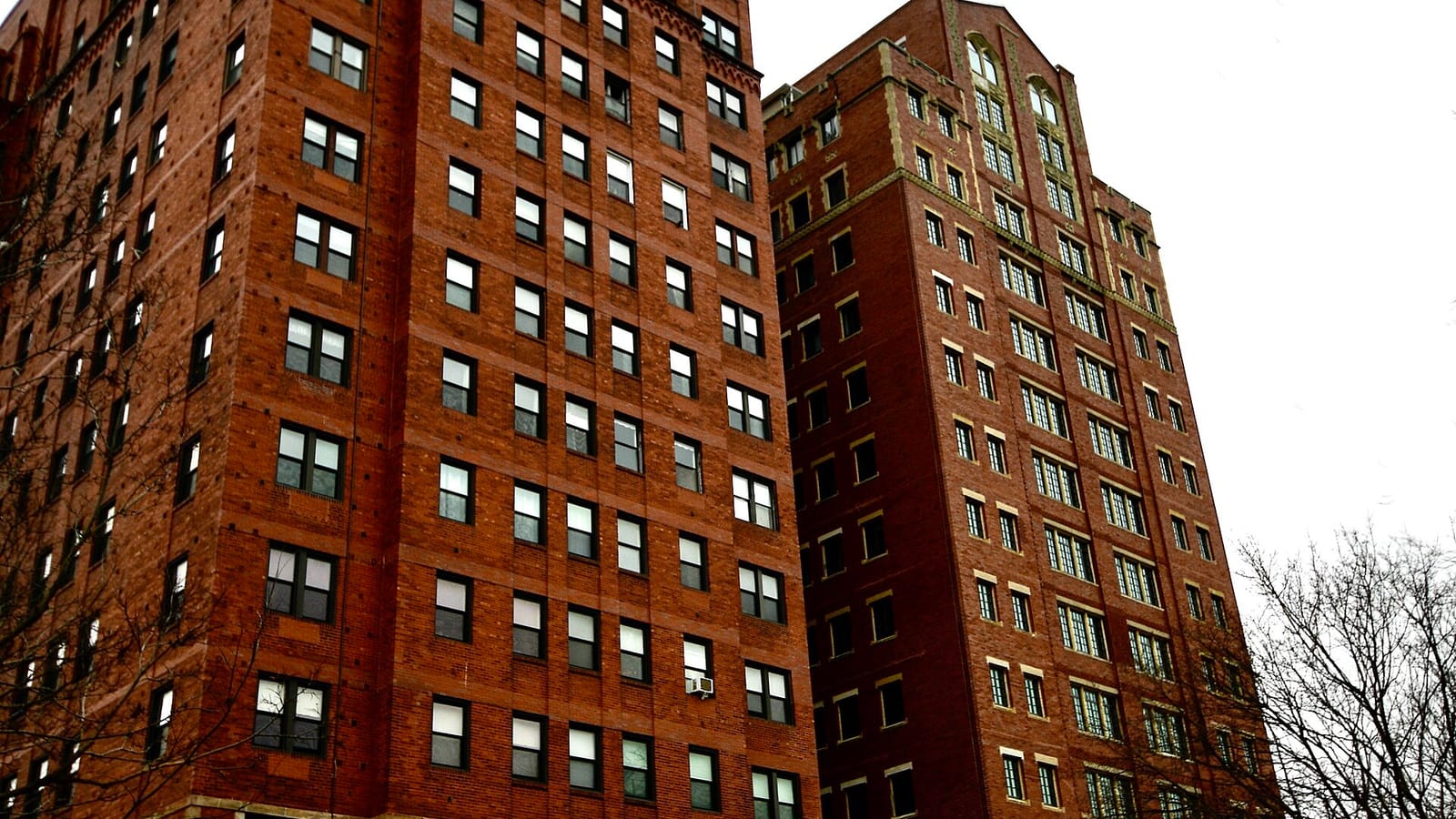 Brick apartment towers with regular rows of windows