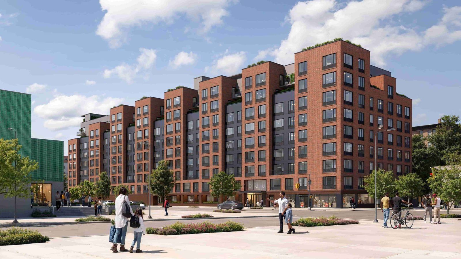 Rendering of a nine-story apartment building of red brick and dark gray panels along a wide street under a blue sky, with stepped rooftop terraces, a glass entrance marked 580, storefronts at street level, street trees, traffic signals and small figures walking on a plaza in front