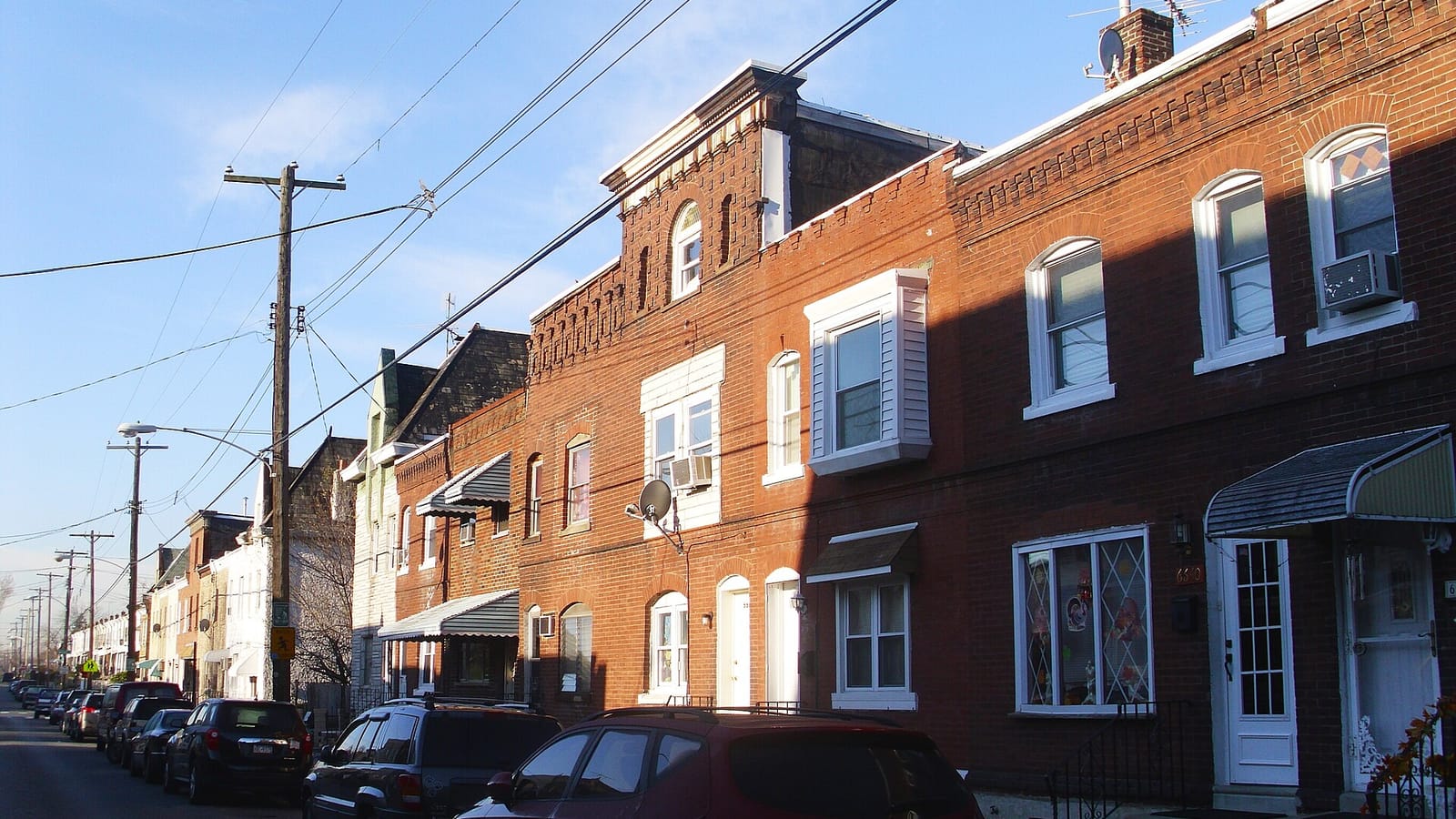 Brick rowhouses lining a residential street