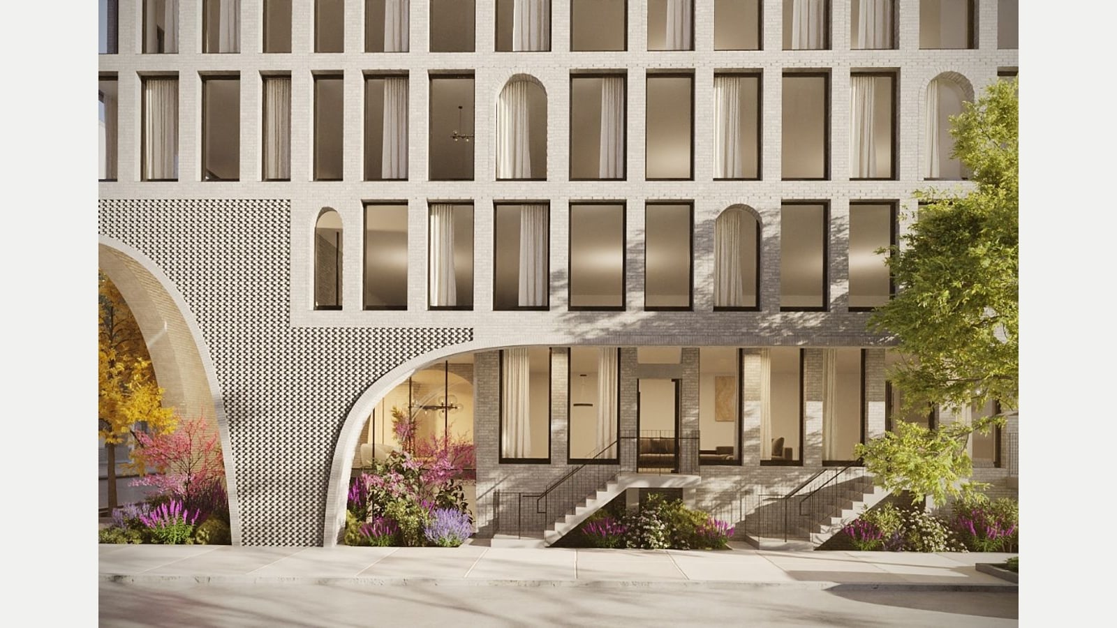 Rendering of the base of a pale gray brick building with rows of tall and arched windows, a large arch cut into a wall of patterned projecting brick, ground-floor windows behind the arch, two stoops with black railings and planted beds of purple and pink flowers along the sidewalk