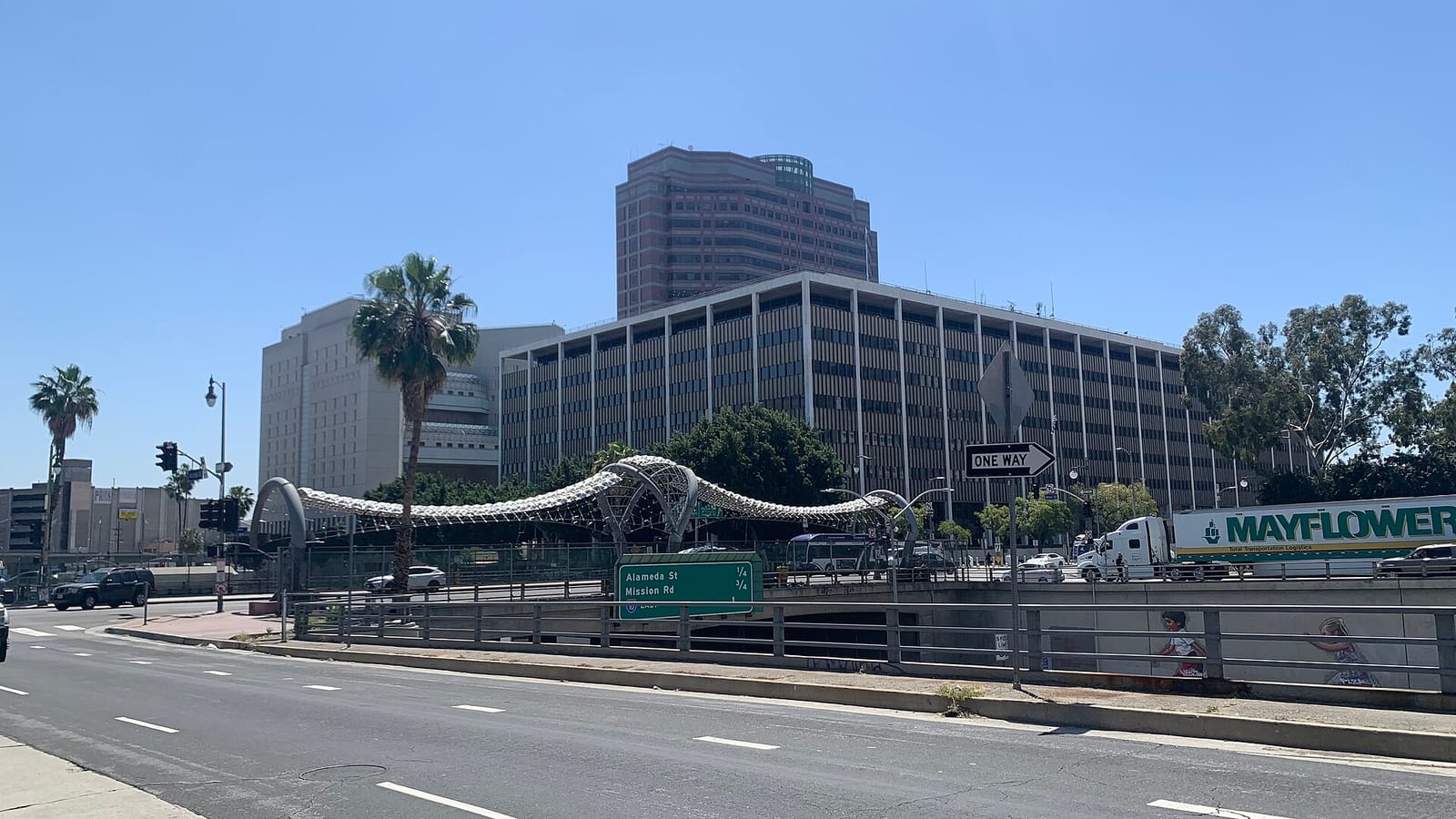Federal office complex beyond trees and a lawn