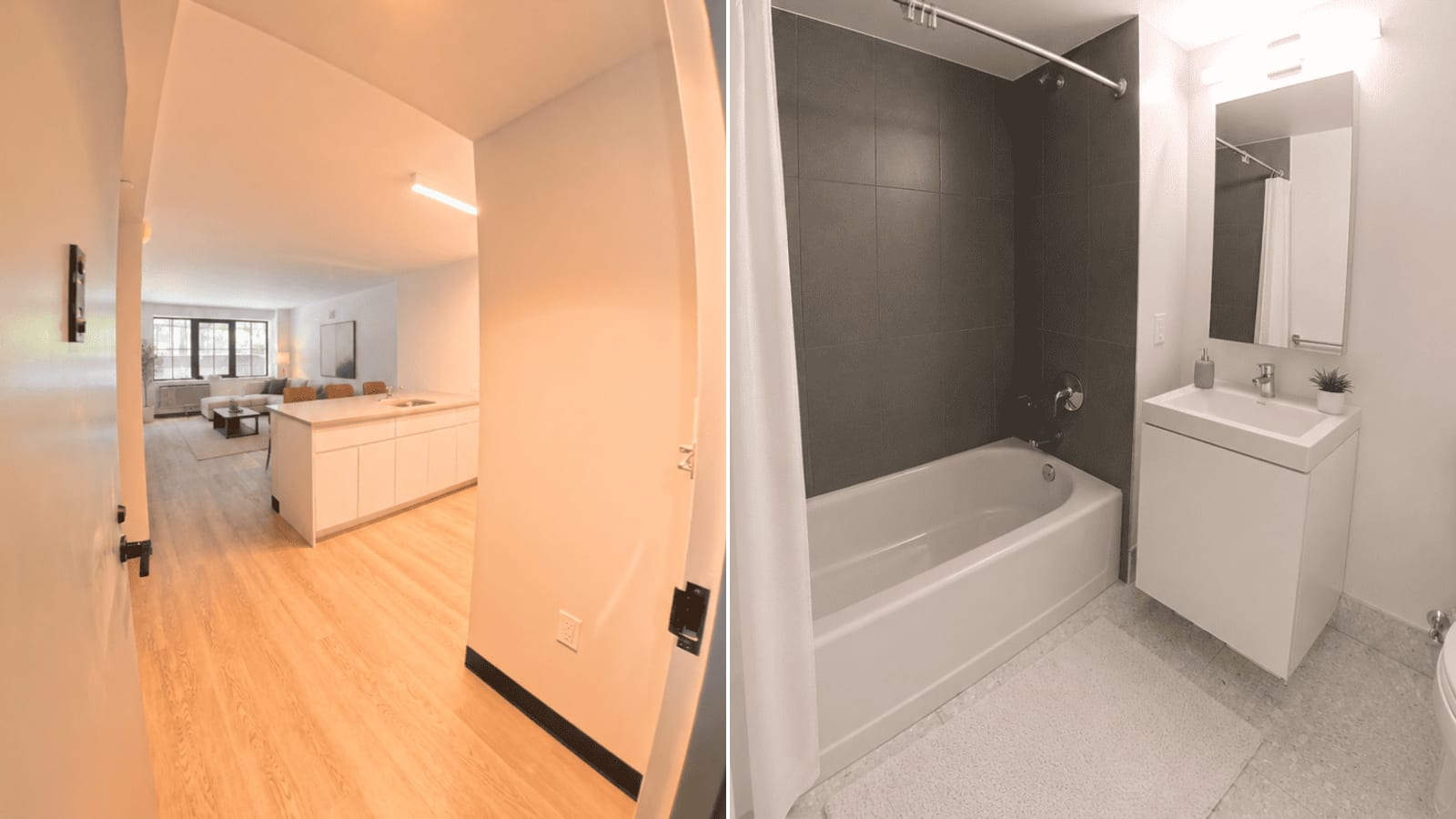 Two photographs side by side: at left a view from an apartment entry hall past a white kitchen peninsula with a sink to a living room with a sofa, a low table and three dark-framed windows above a wall unit; at right a bathroom with a white bathtub, dark grey wall tile, a shower curtain, a white wall-hung vanity and a mirrored cabinet
