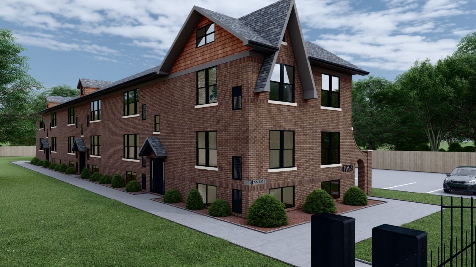 Rendering of a long brick apartment building with a steep gabled front, three rows of windows, shrubs along the side wall and a paved parking area behind a fence