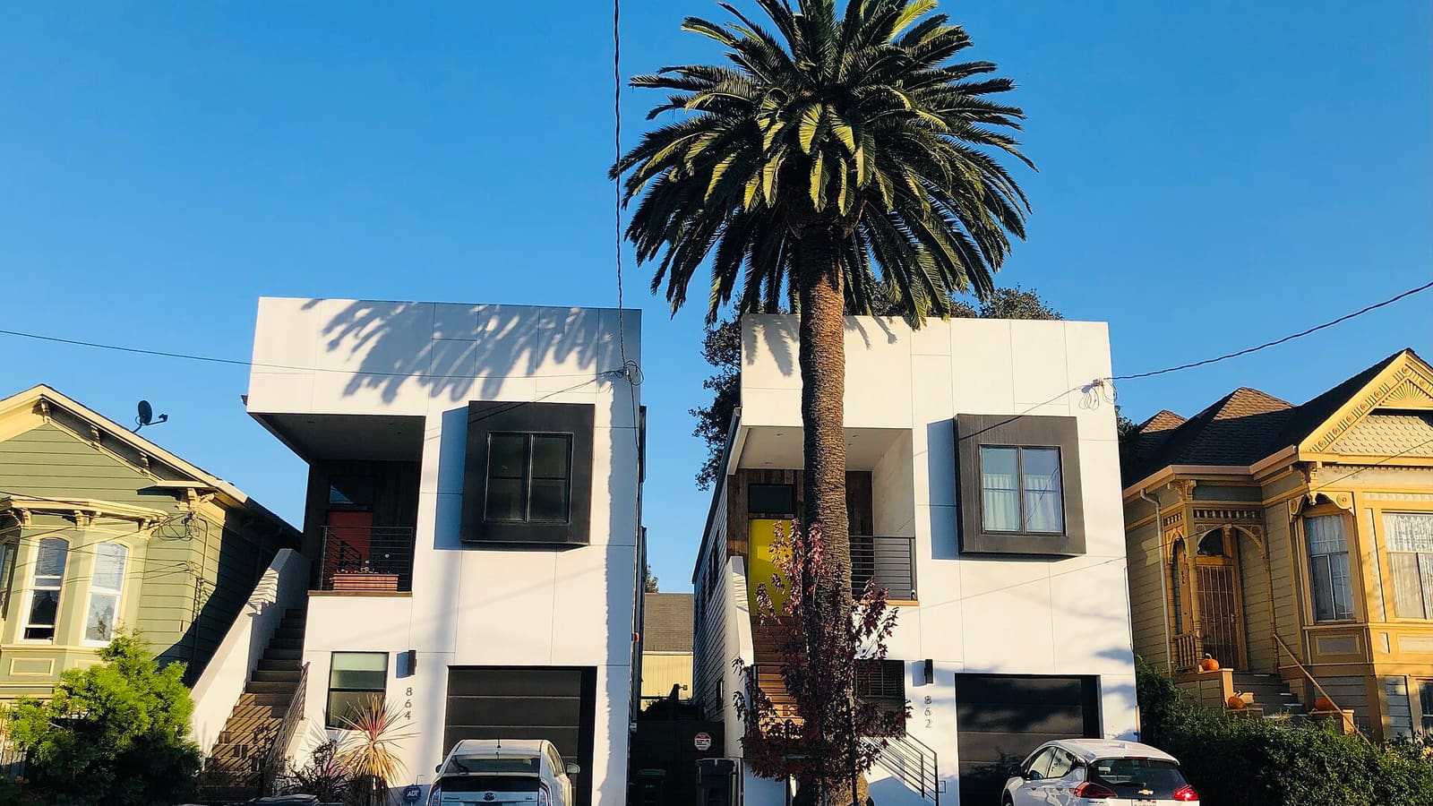 Modern and older houses on a residential street in Prescott, Oakland