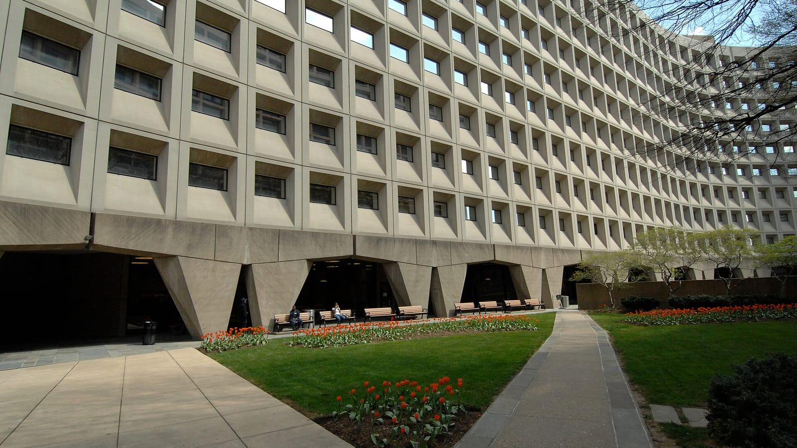 Concrete federal office building beside a lawn