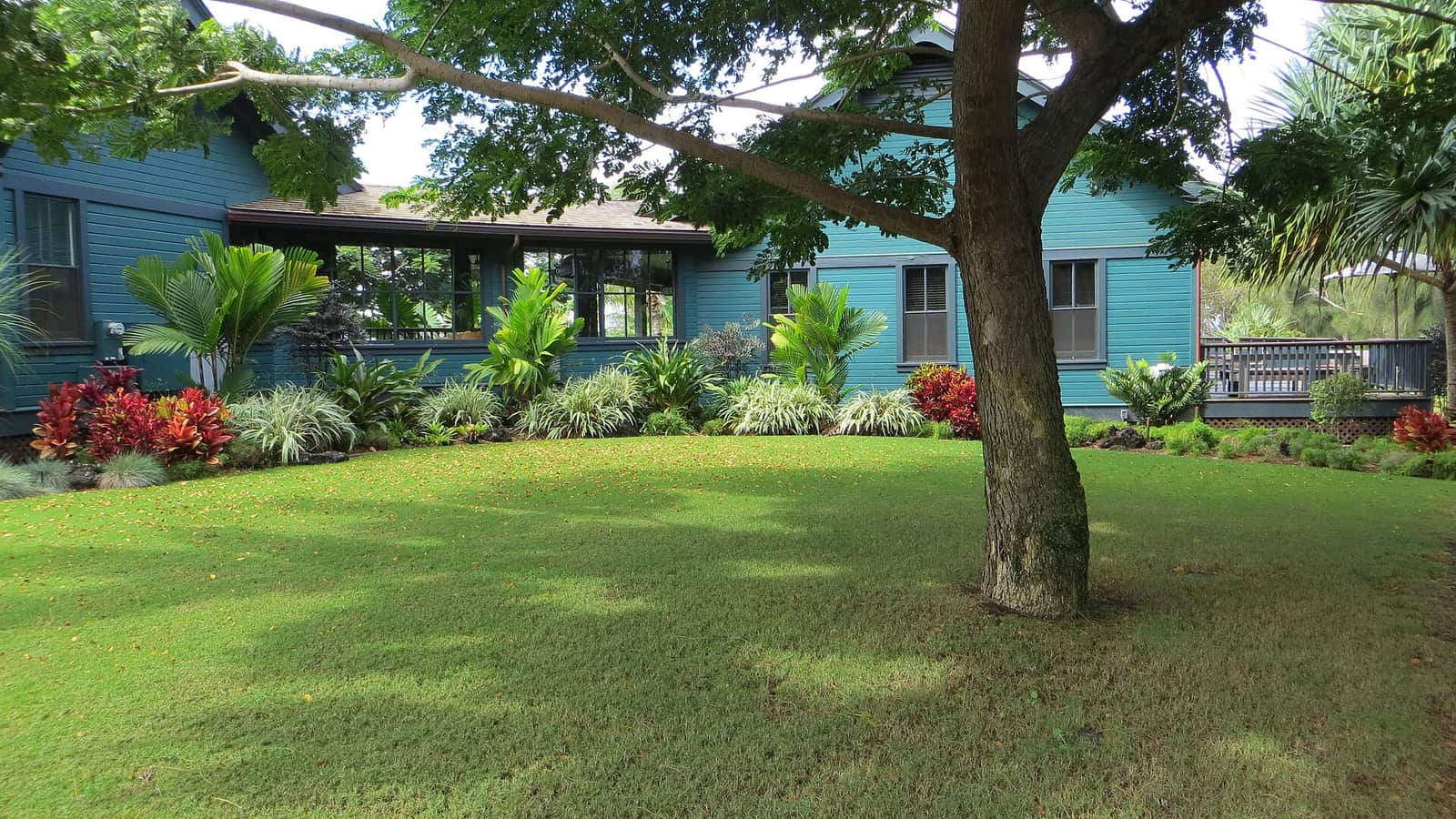 Residential building with a covered walkway and a lawn