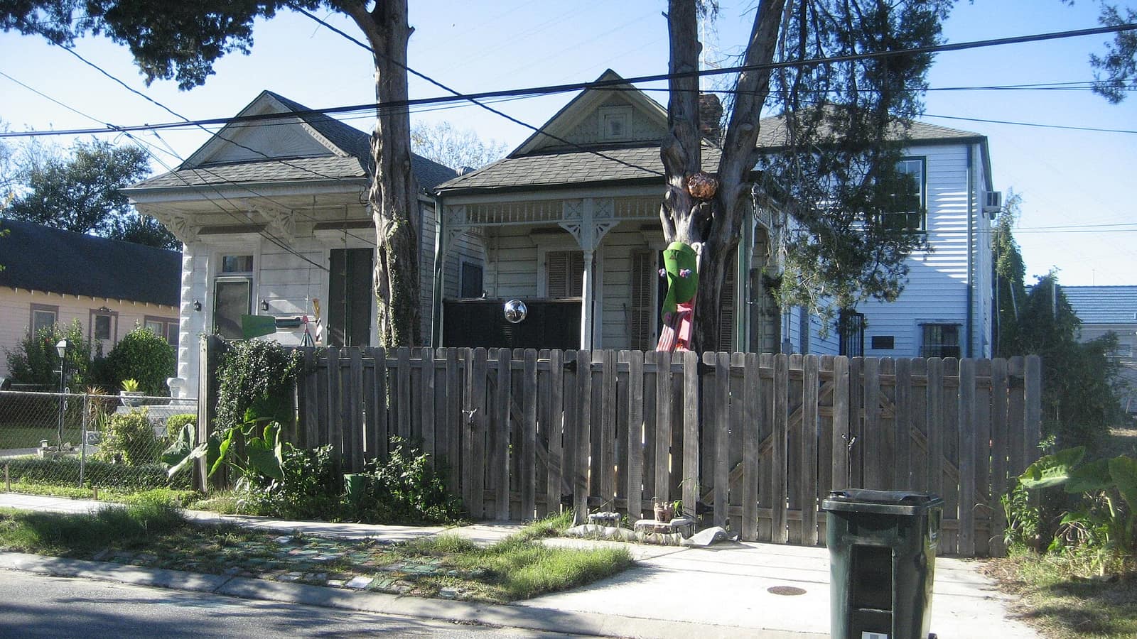 Houses with front porches along a sidewalk